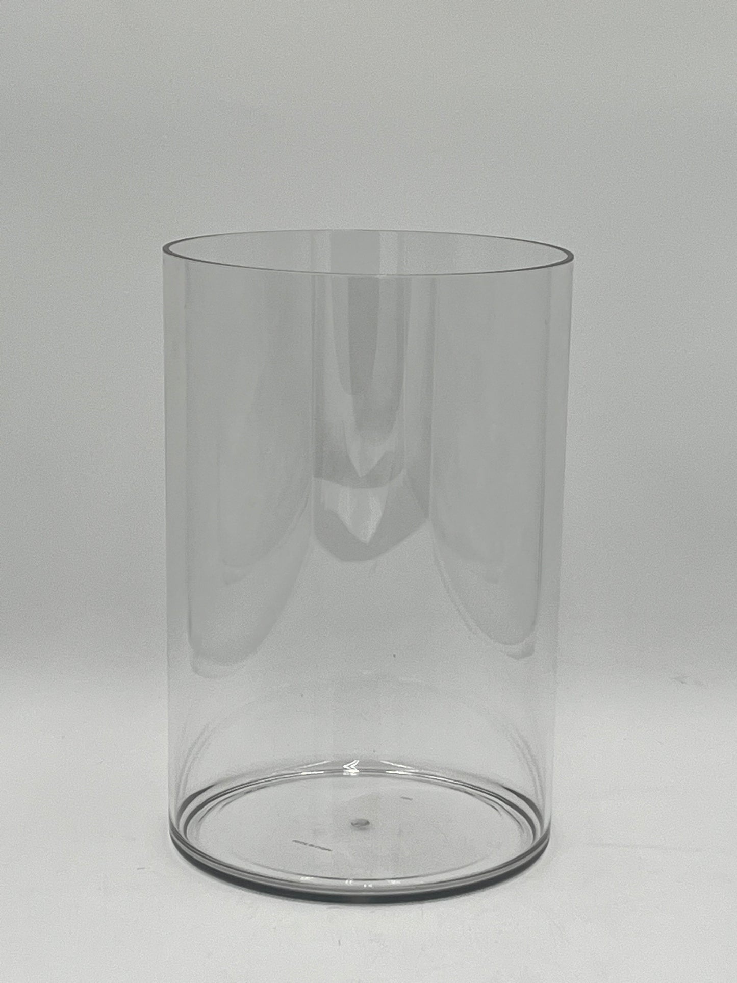 Clear plastic cylinder vases in four sizes for floral design, candles, or decor use. Lightweight and modern. Sold individually by floralsuppliespoint1.com.