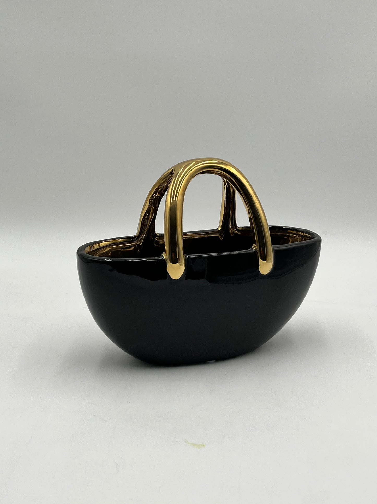 The Arcora series of vases are sculptural ceramic objects that transcends traditional form 7x8.5 Op, sold by floralsuppliespoint1.com
