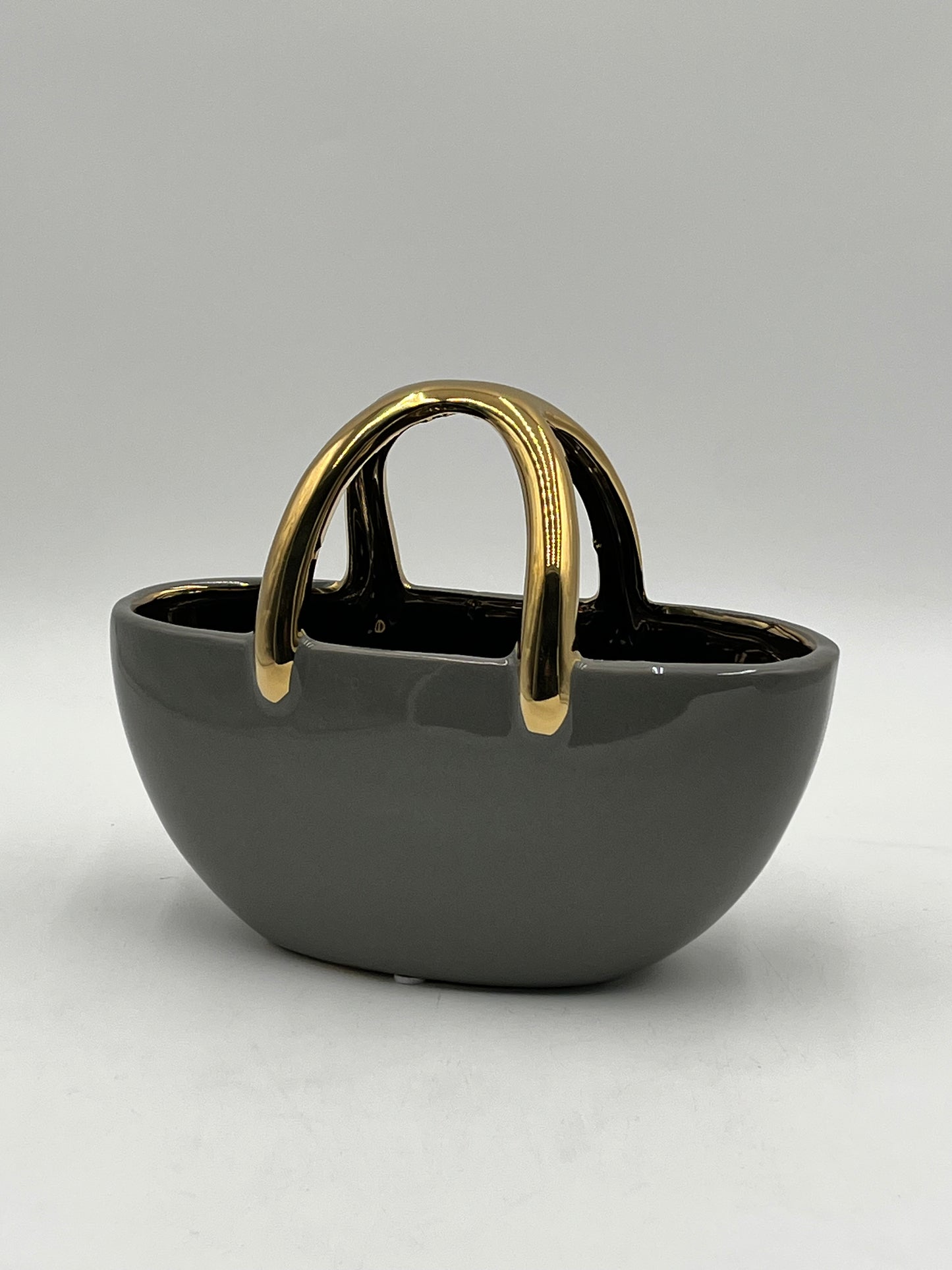 The Arcora series of vases are sculptural ceramic objects that transcends traditional form 7x8.5 Op, sold by floralsuppliespoint1.com