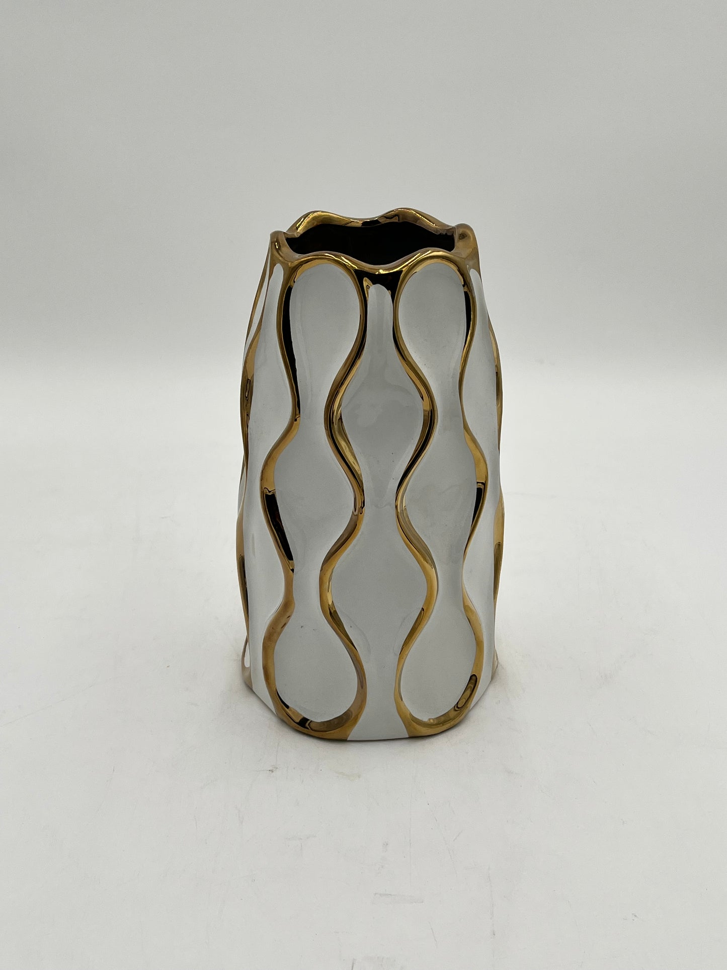 Auric Wave ceramic vases in black & white with gold wave detailing. Elegant décor accent pieces available in 5 sizes & sold by floralsuppliespoint1.com.