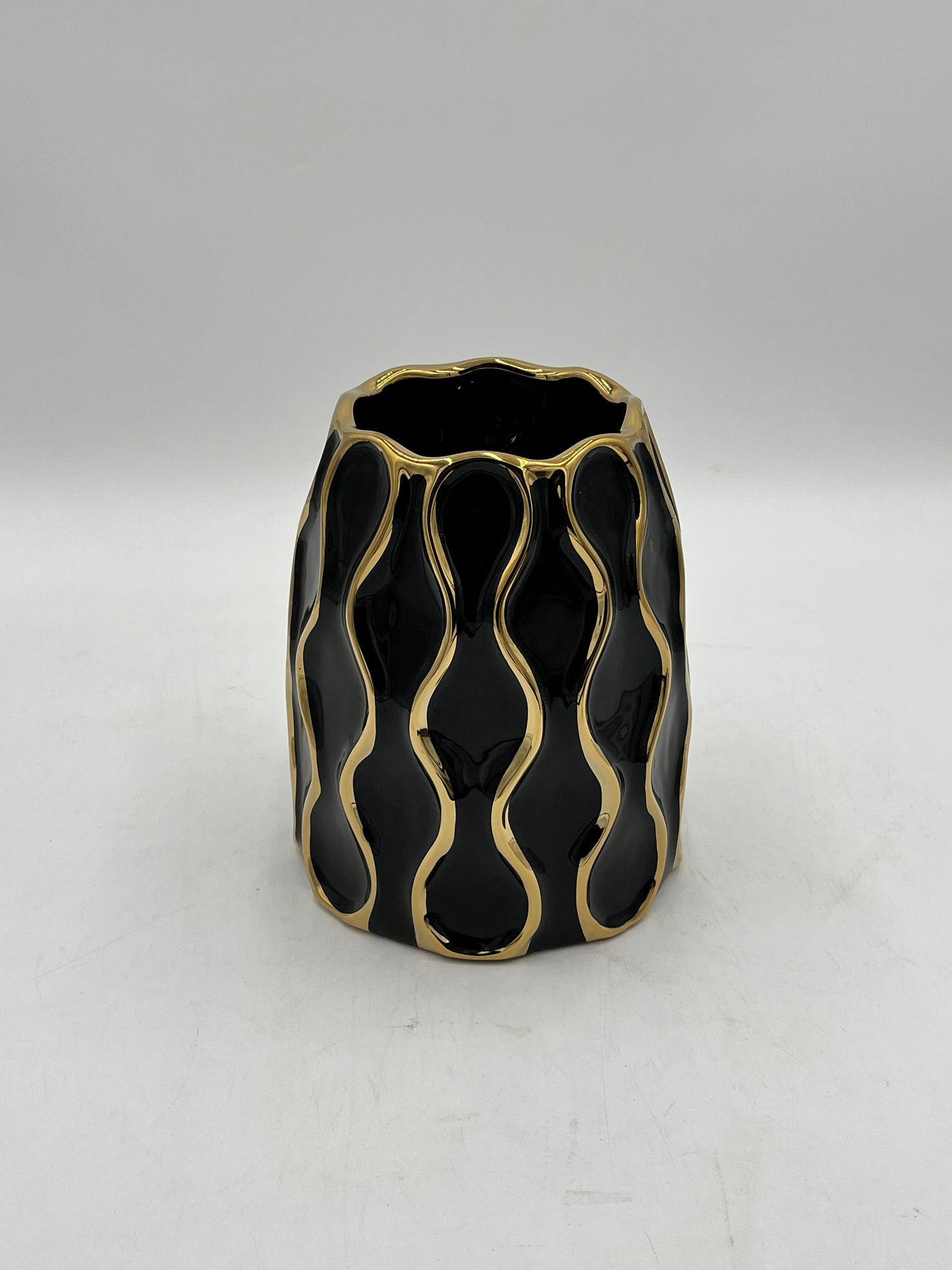 Auric Wave ceramic vases in black & white with gold wave detailing. Elegant décor accent pieces available in 5 sizes & sold by floralsuppliespoint1.com.