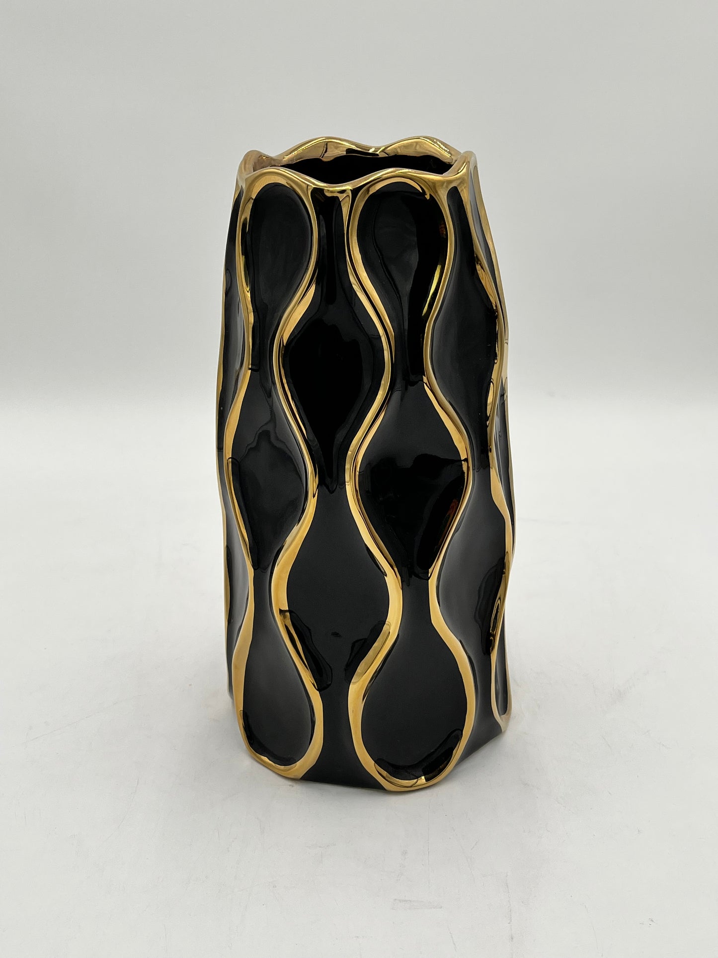 Auric Wave ceramic vases in black & white with gold wave detailing. Elegant décor accent pieces available in 5 sizes & sold by floralsuppliespoint1.com.
