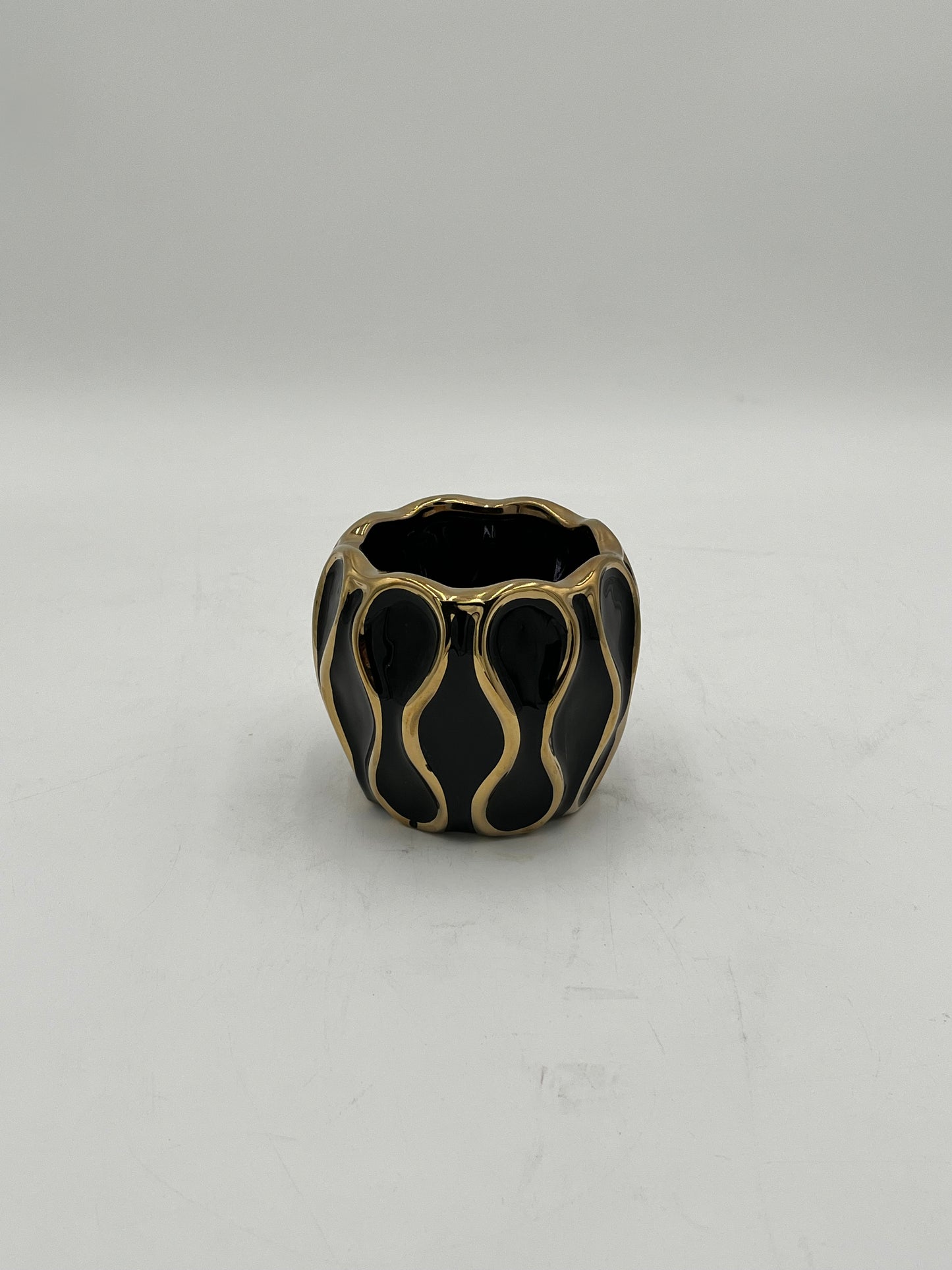 Auric Wave ceramic vases in black & white with gold wave detailing. Elegant décor accent pieces available in 5 sizes & sold by floralsuppliespoint1.com.
