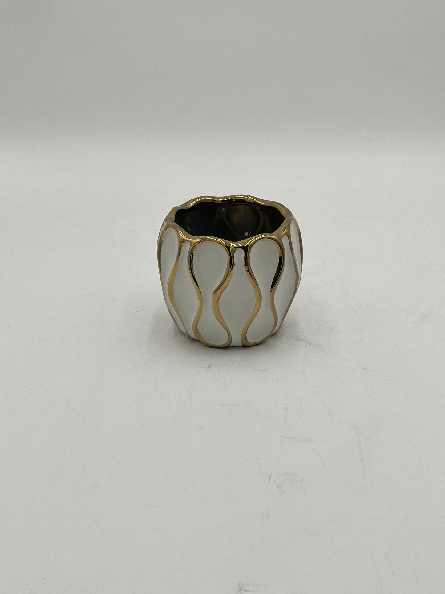 Auric Wave ceramic vases in black & white with gold wave detailing. Elegant décor accent pieces available in 5 sizes & sold by floralsuppliespoint1.com.