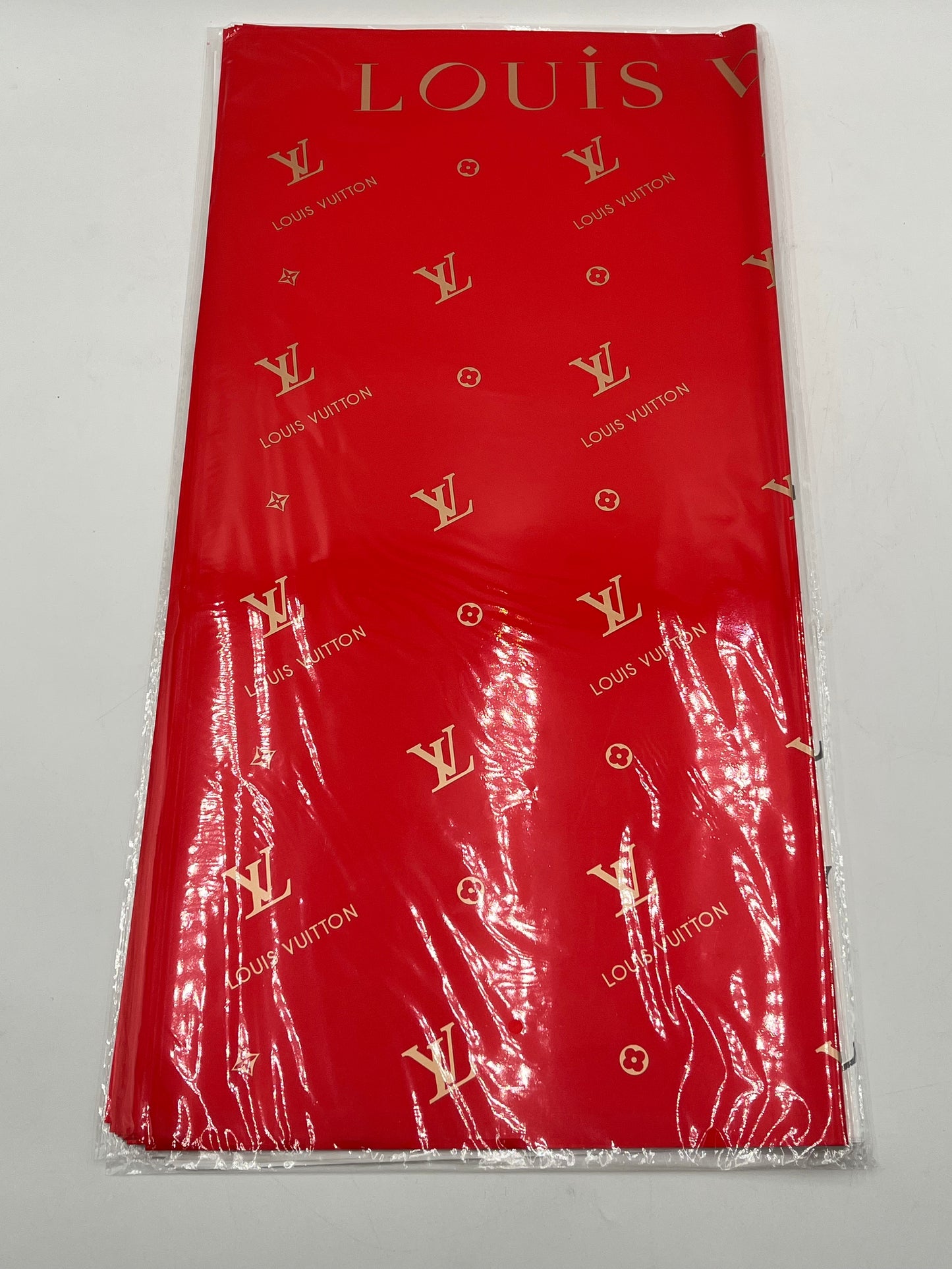 Enhance gifting with the Couture LV Collection. 20 luxury wrapping sheets (22x22) in red. $9.99 per pack, Sold by floralsuppliespoint1.com