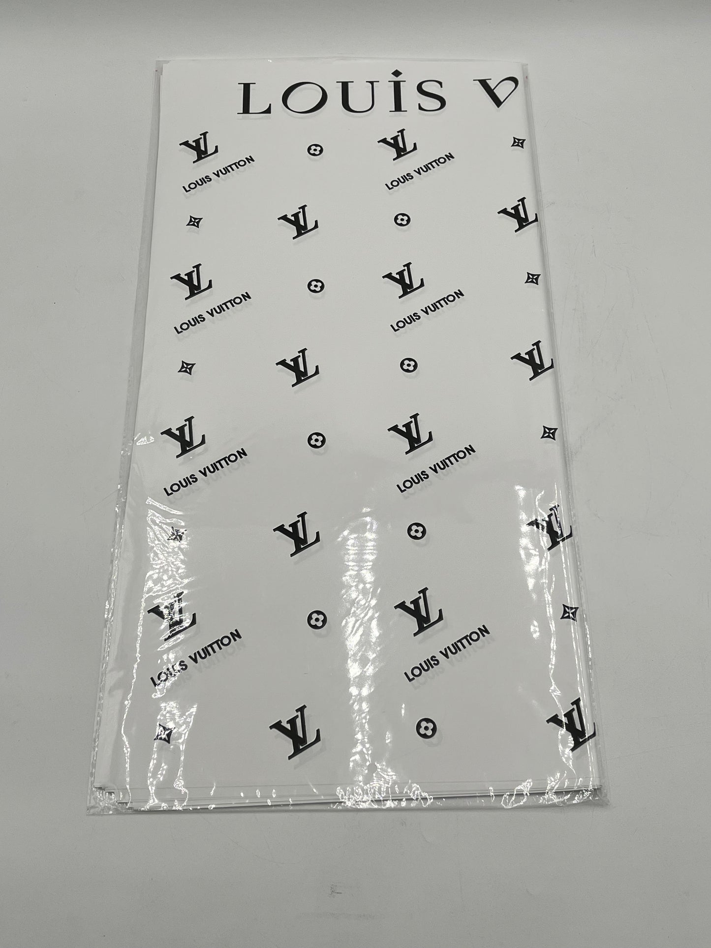 Enhance gifting with the Couture LV Collection. 20 luxury wrapping sheets (22x22) in white. $9.99 per pack, Sold by floralsuppliespoint1.com