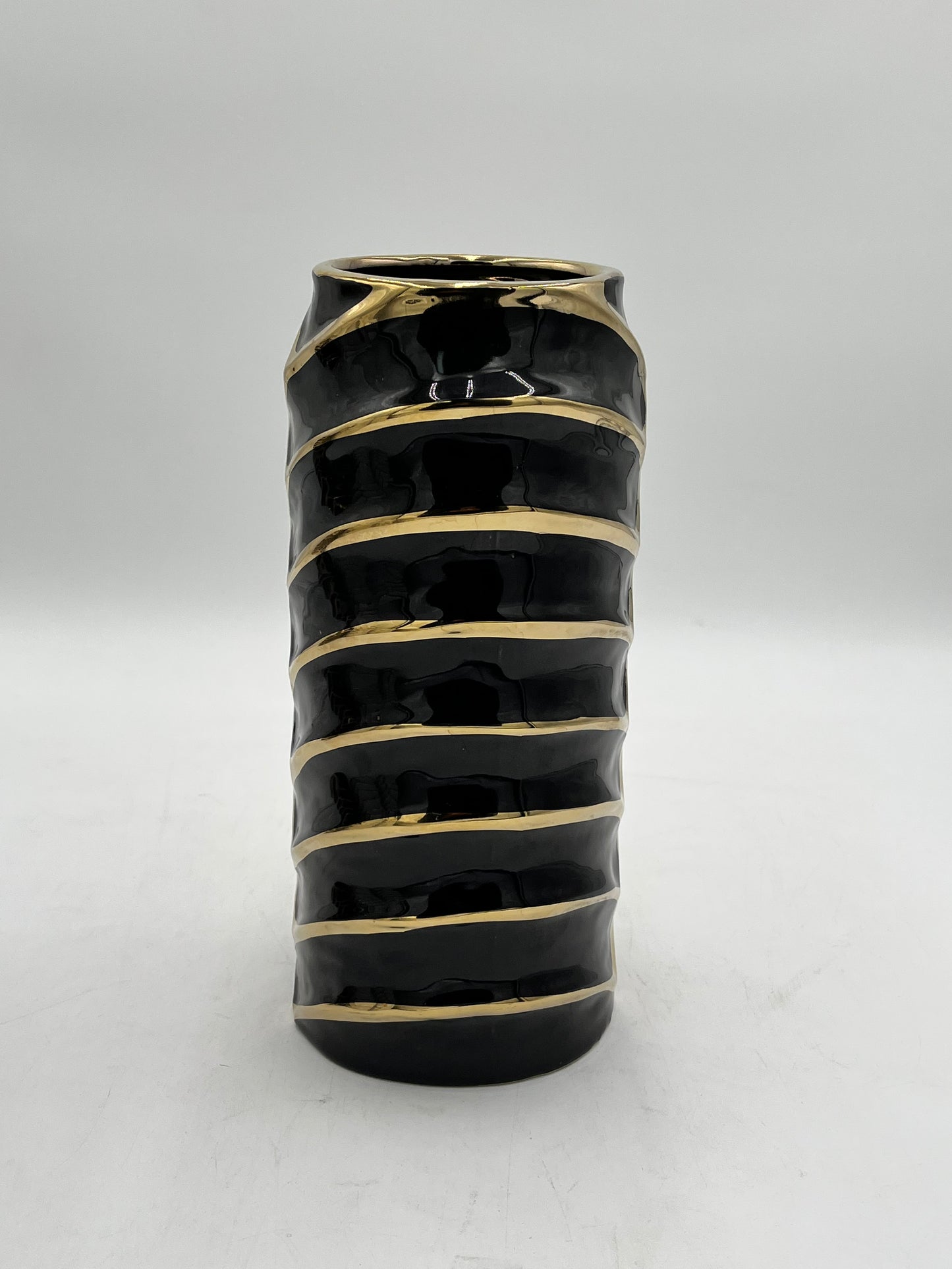 12 x 4 ceramic vases with a modern chevron design with gold accents in black, sold by floralsuppliespoint1.com