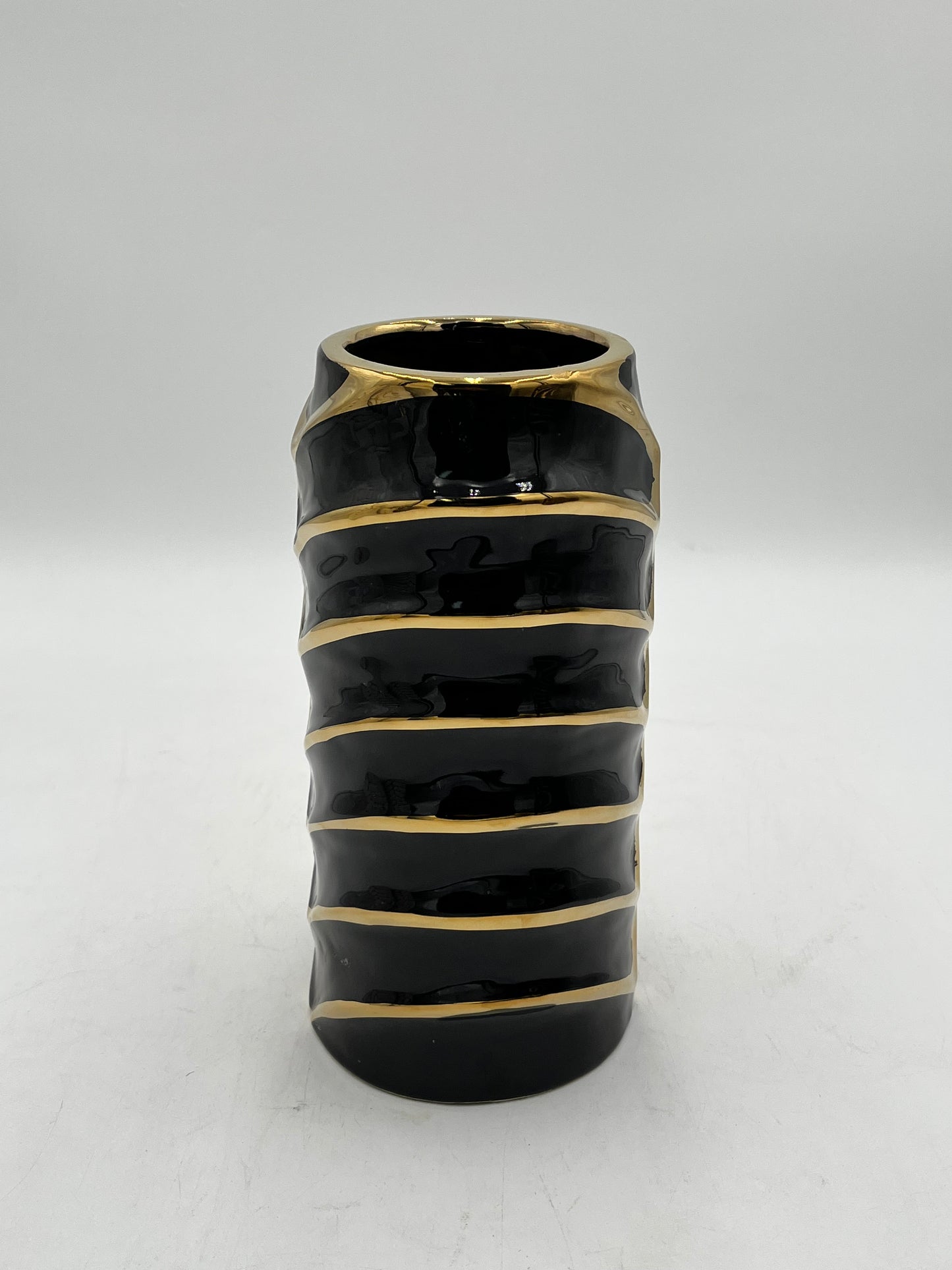 10 x 3 ceramic vases with a modern chevron design with gold accents in black, sold by floralsuppliespoint1.com