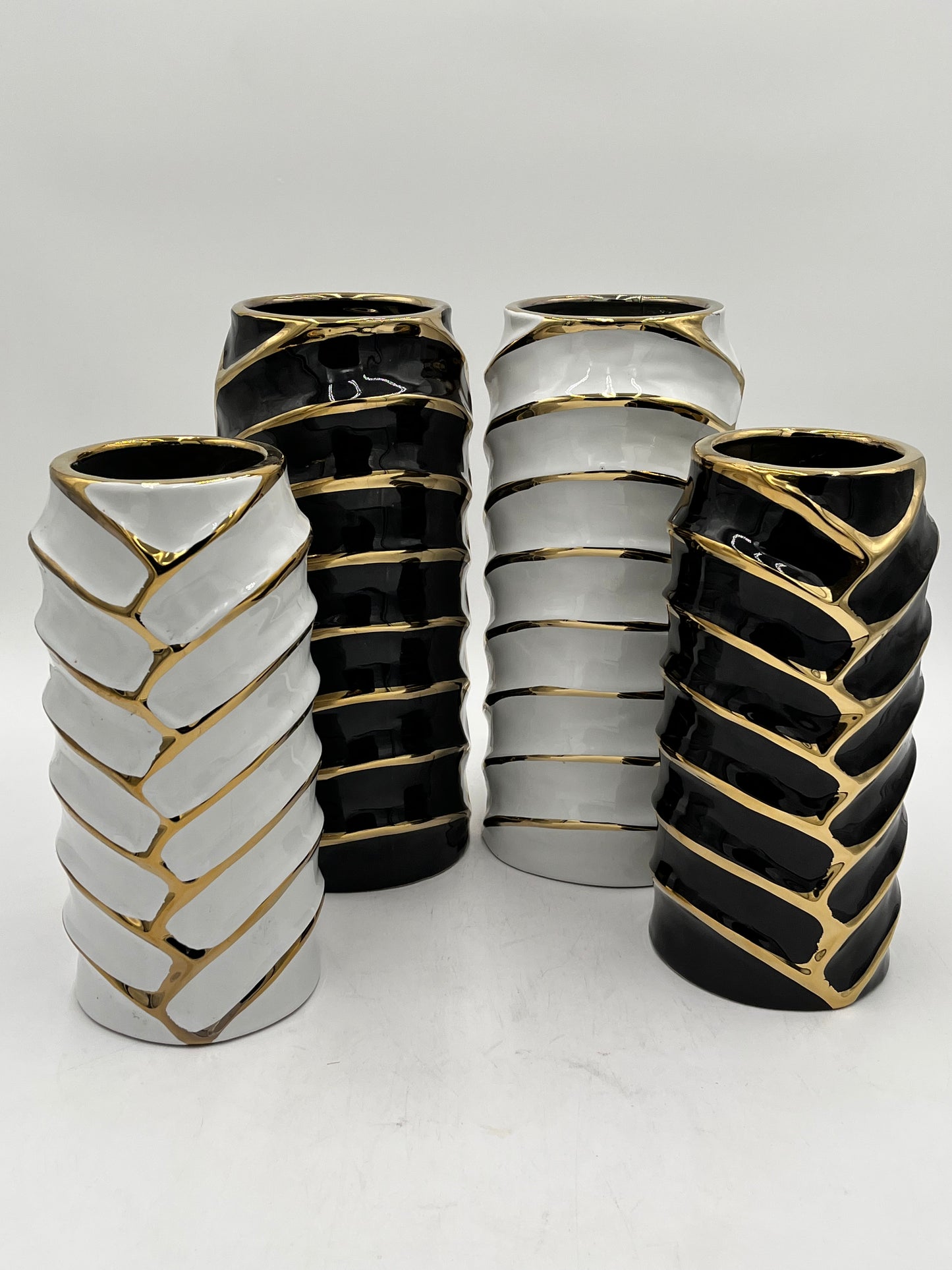 Set of two ceramic vases with a modern chevron design with gold accents in black or white, sold by floralsuppliespoint1.com