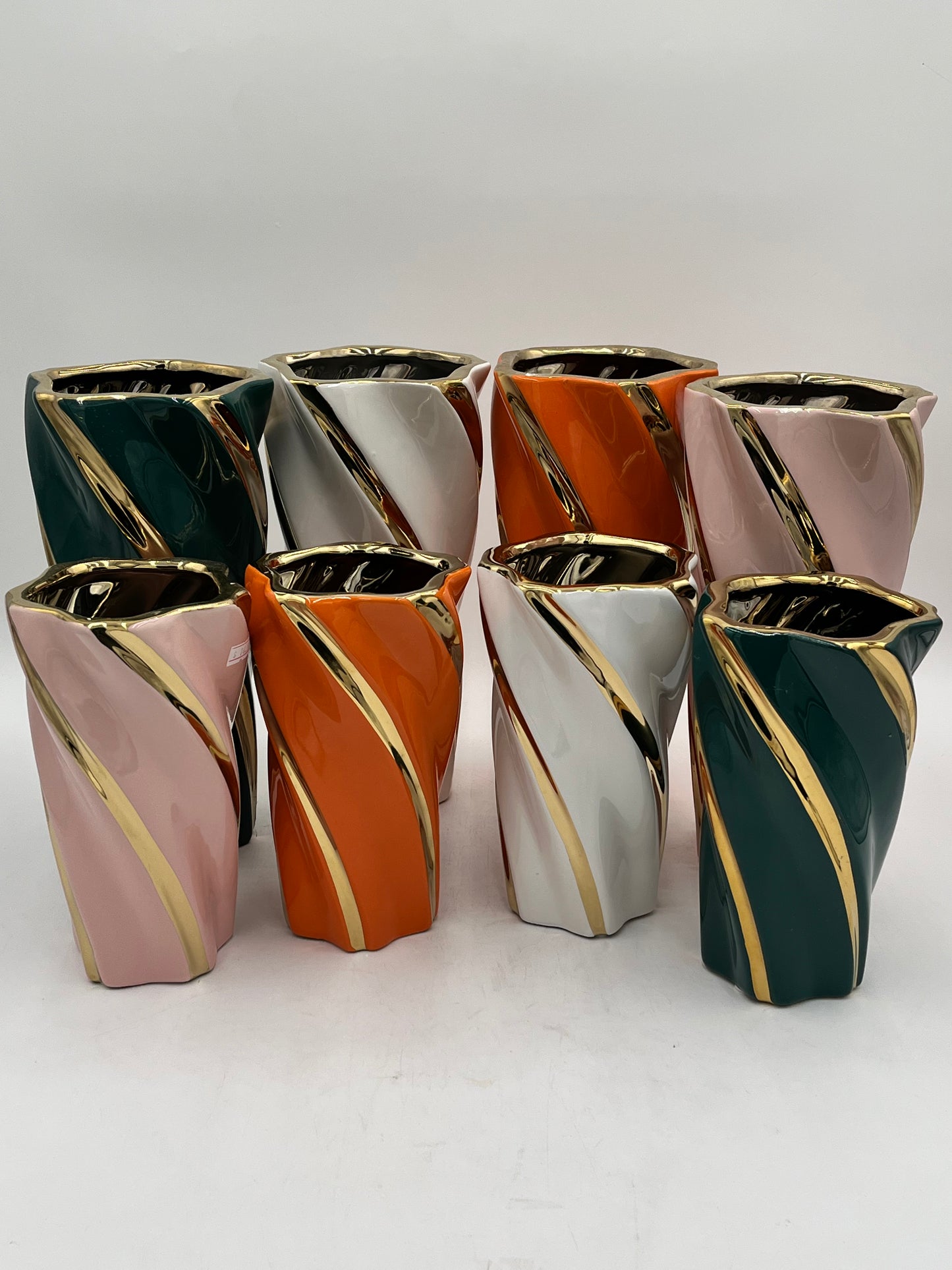 Gilded Helix ceramic vases with gold swirl in Pink, Orange, Green & White. Also available in 2 sizes M-$14.99 & L-$19.99. Sold by floralsuppliespoint1.com.