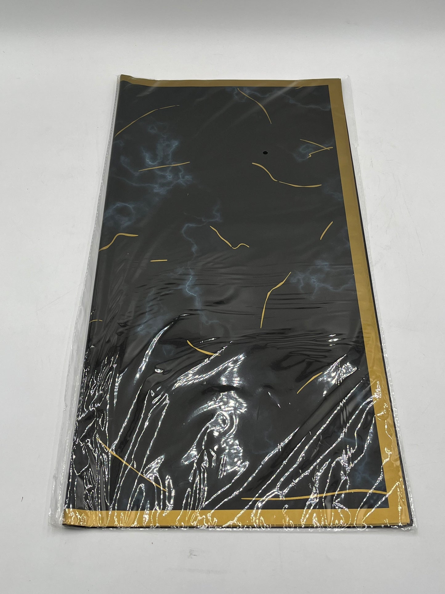 Gilded Marble Vein Trio 22x22 inch (20 sheets) wrapping papers in Black . Sold by floralsuppliespoint1.com for $9.99.