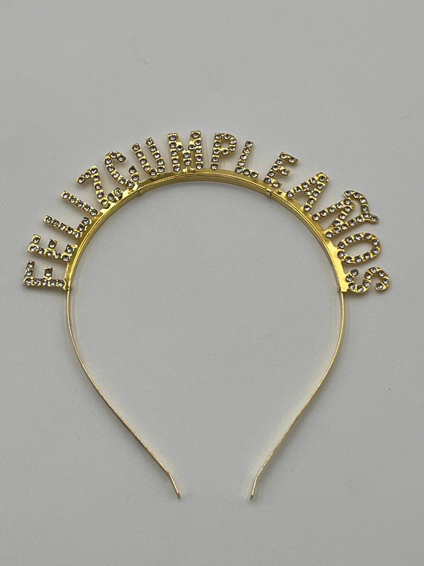 Gold Rhinestone "Feliz Cumpleaños" headband, 5" tall, sold retail & wholesale by floralsuppliespoint1.com.