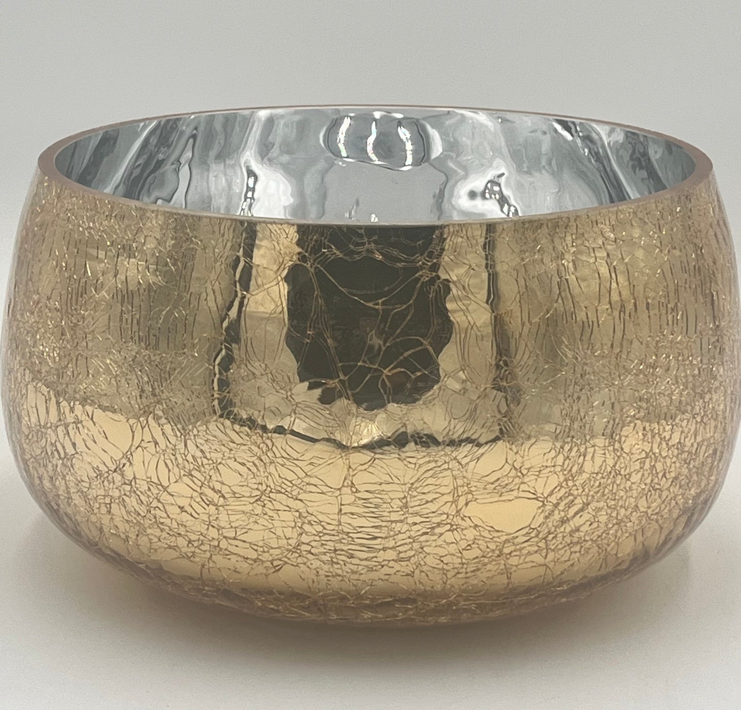 The Golden Craquelure 5.75x8.5 Op by Floral Supplies Point features a round metallic bowl with a gold craquelure finish and a reflective silver interior, embodying modern elegance against a plain white background.