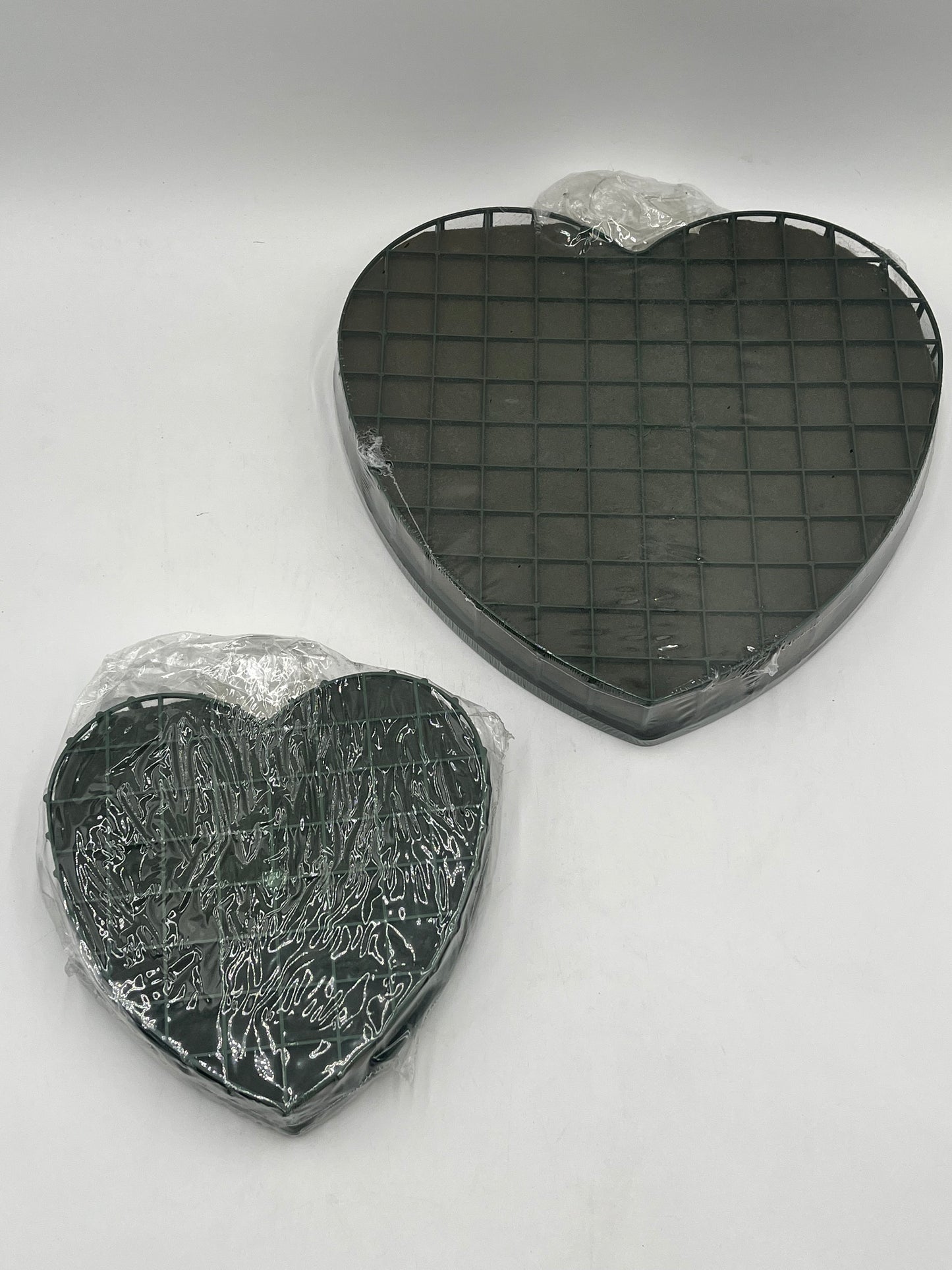 Heart-shaped floral foam wreath bases, 8" & 12", keep flowers fresh with water-absorbing foam & sturdy backing. Sold by floralsuppliespoint1.com.