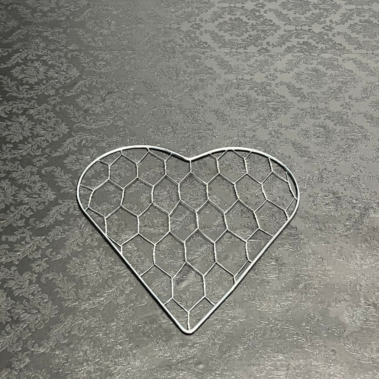 A ♡ of Haven wire heart frame in small size for floral design, sold for $9.99 by floralsuppliespoint1.com.