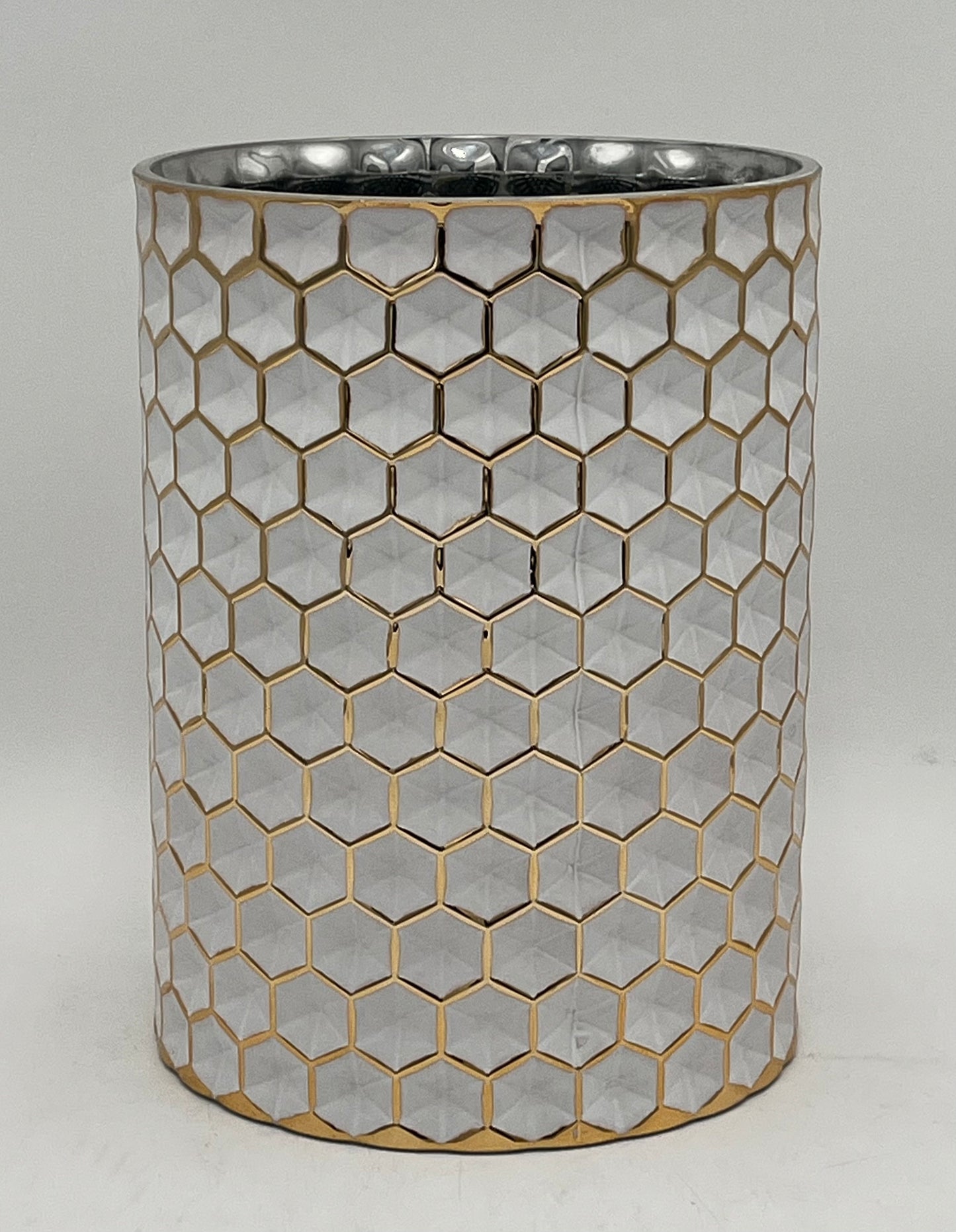 The Hexara Column 9.5x6.5 Op by Floral supplies Point is a cylindrical silver column with a modern honeycomb relief pattern outlined in gold, displayed on a plain white background.