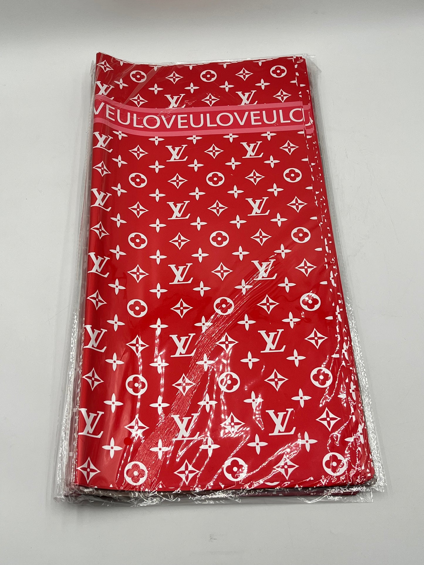 LOVEU LV Luxe Set wrapping paper in Red with iconic LV monogram. 20 sheets of 22"x22", Sold by floralsuppliespoint1.com for $9.99