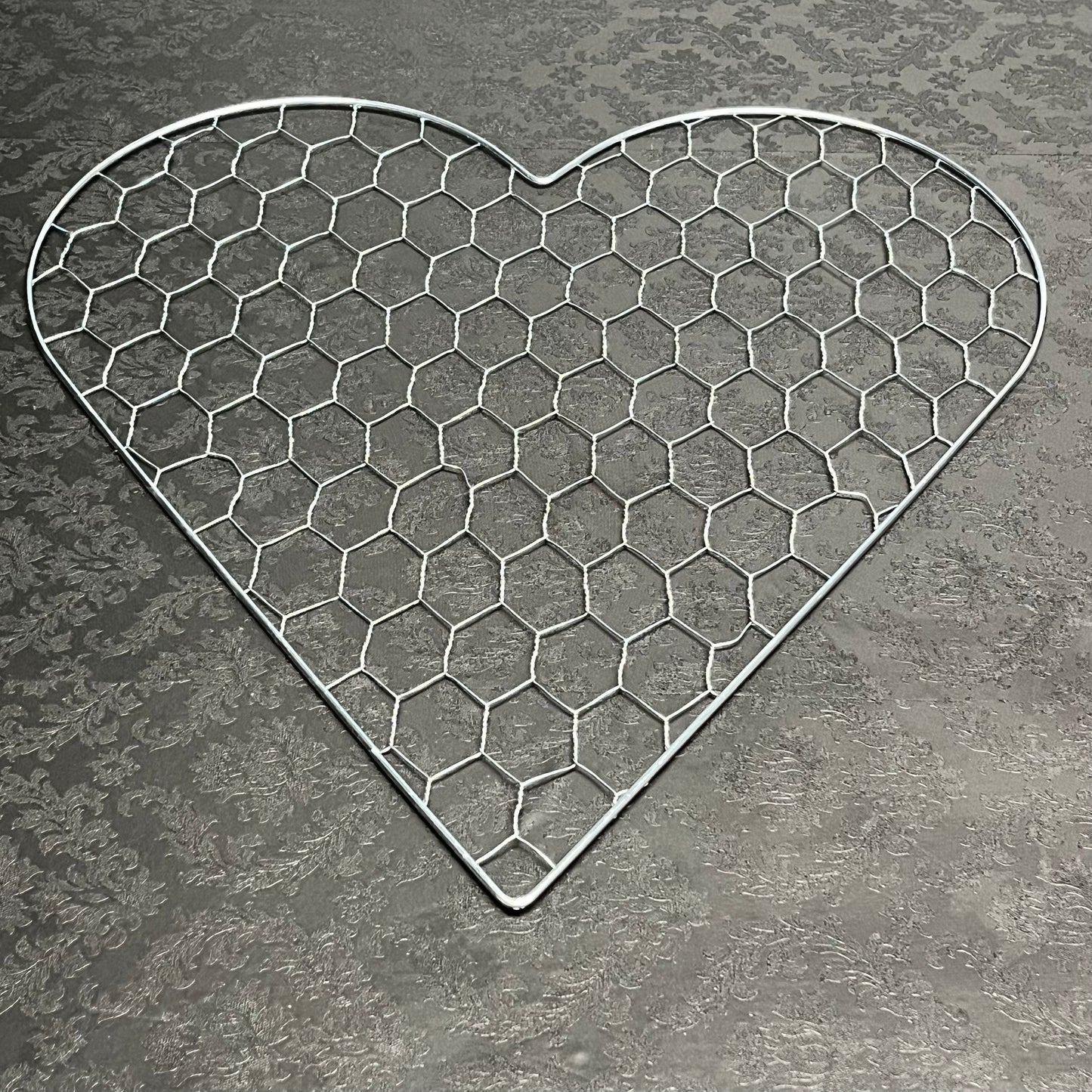 A ♡ of Haven wire heart frame in large size for floral design, sold for $13.99 by floralsuppliespoint1.com.
