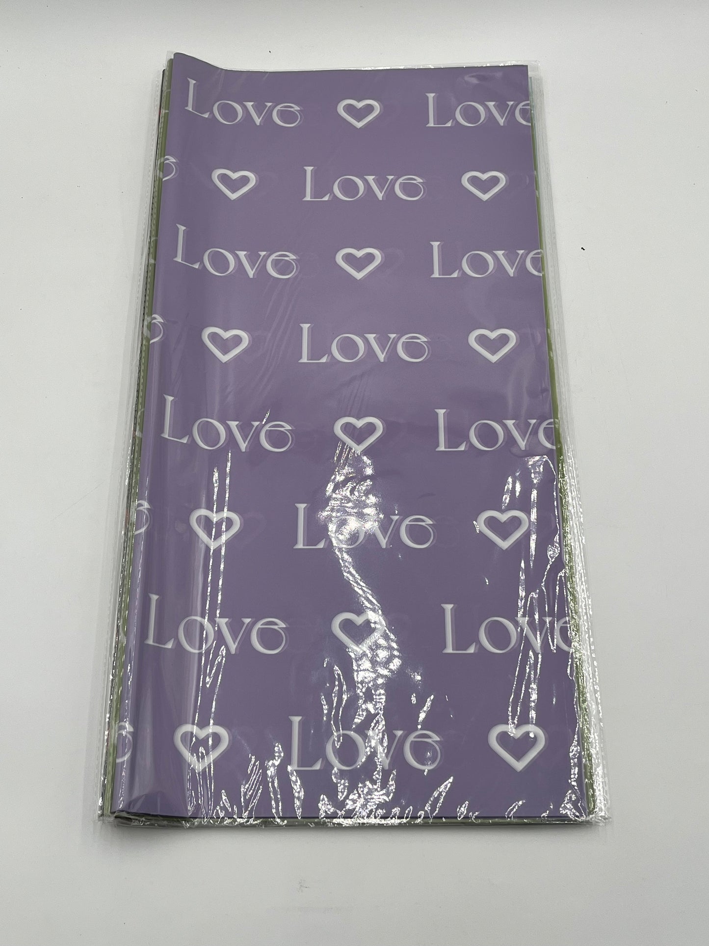 LOVE Wraps Edition in Lavender, 22x22 inch sheets with heart and “LOVE” design. Sold @ floralsuppliespoint1.com for $9.99