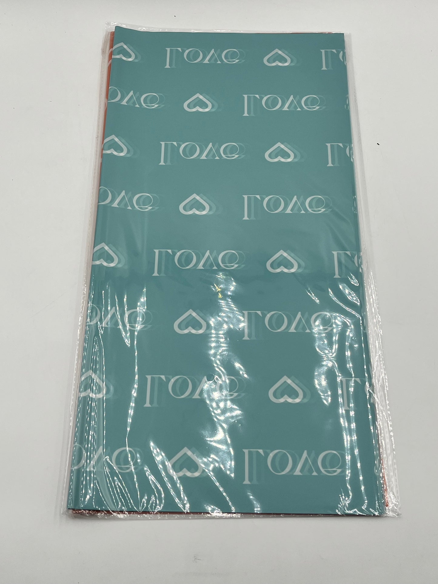 LOVE Wraps Edition in Light Blue, 22x22 inch sheets with heart and “LOVE” design. Sold @ floralsuppliespoint1.com for $9.99