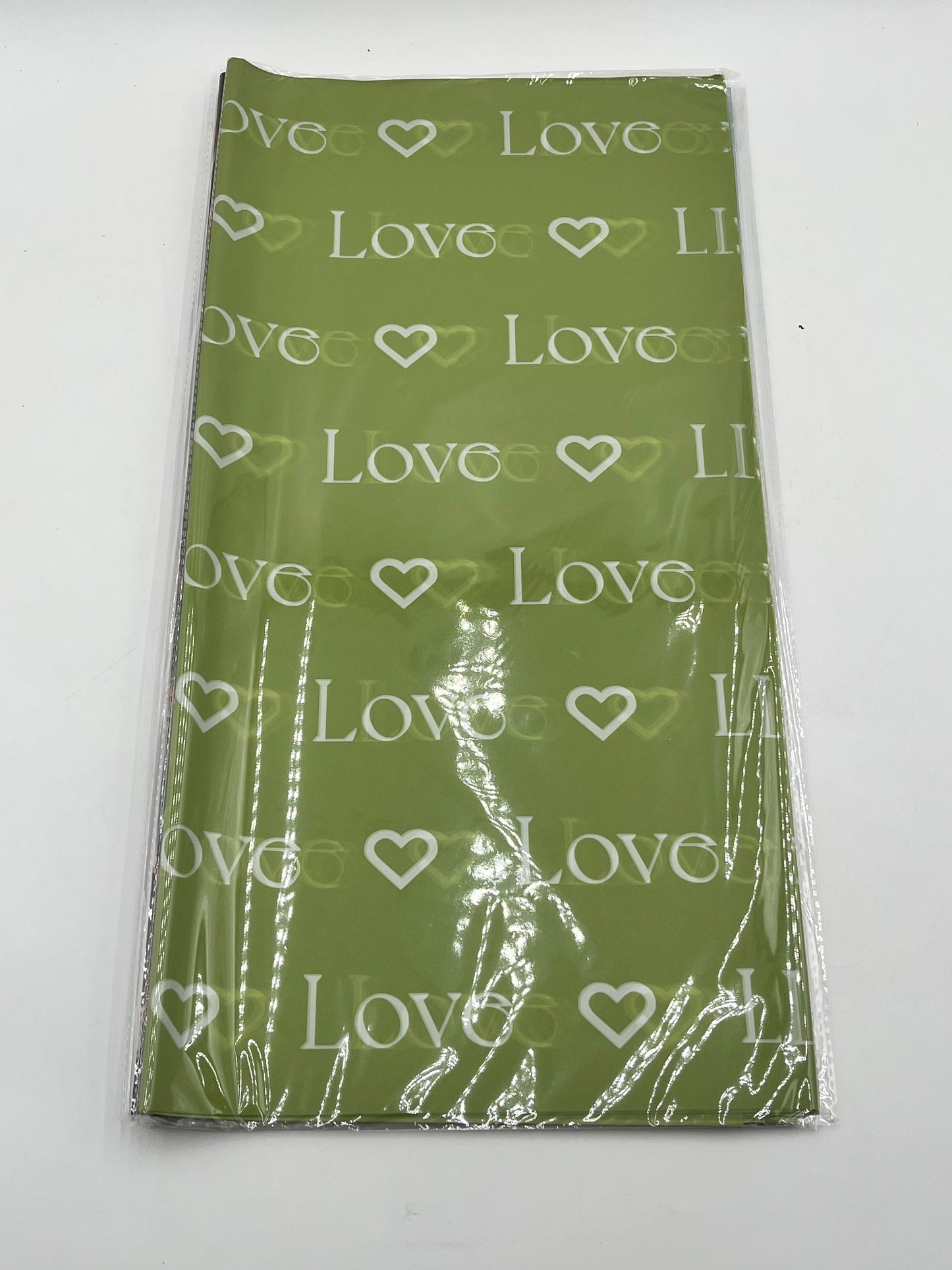 LOVE Wraps Edition in Light Green, 22x22 inch sheets with heart and “LOVE” design. Sold @ floralsuppliespoint1.com for $9.99