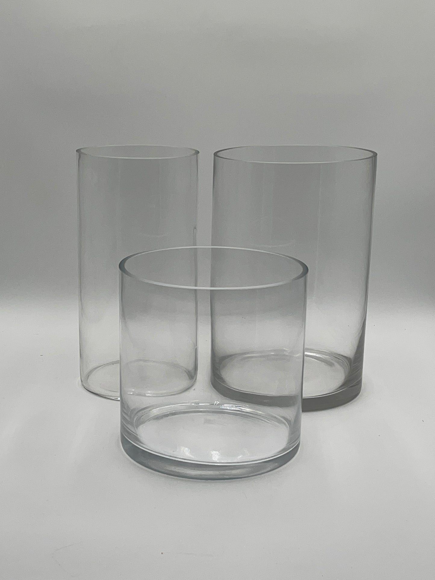 LuxeRound Cylinder Trio clear glass vases in small, medium, and large sizes for floral arrangements, home décor, or event use. Available individually and bulk at floralsuppliespoint1.com.
