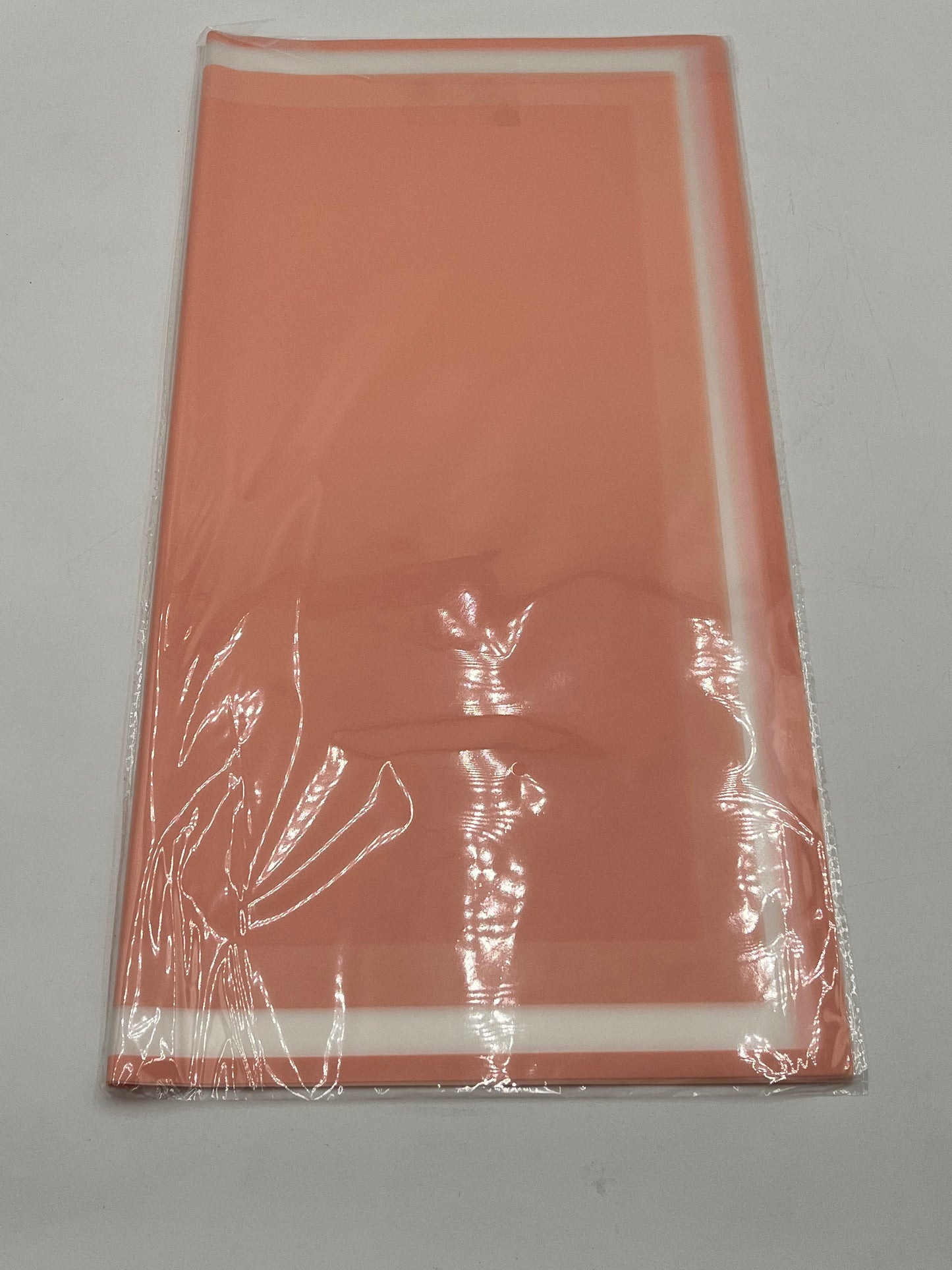 Elegant floral wraps with bold white trim. The Opaline Edge Set in Peach, 22x22", 20 sheets. Sold by floralsuppliespoint1.com for $9.99