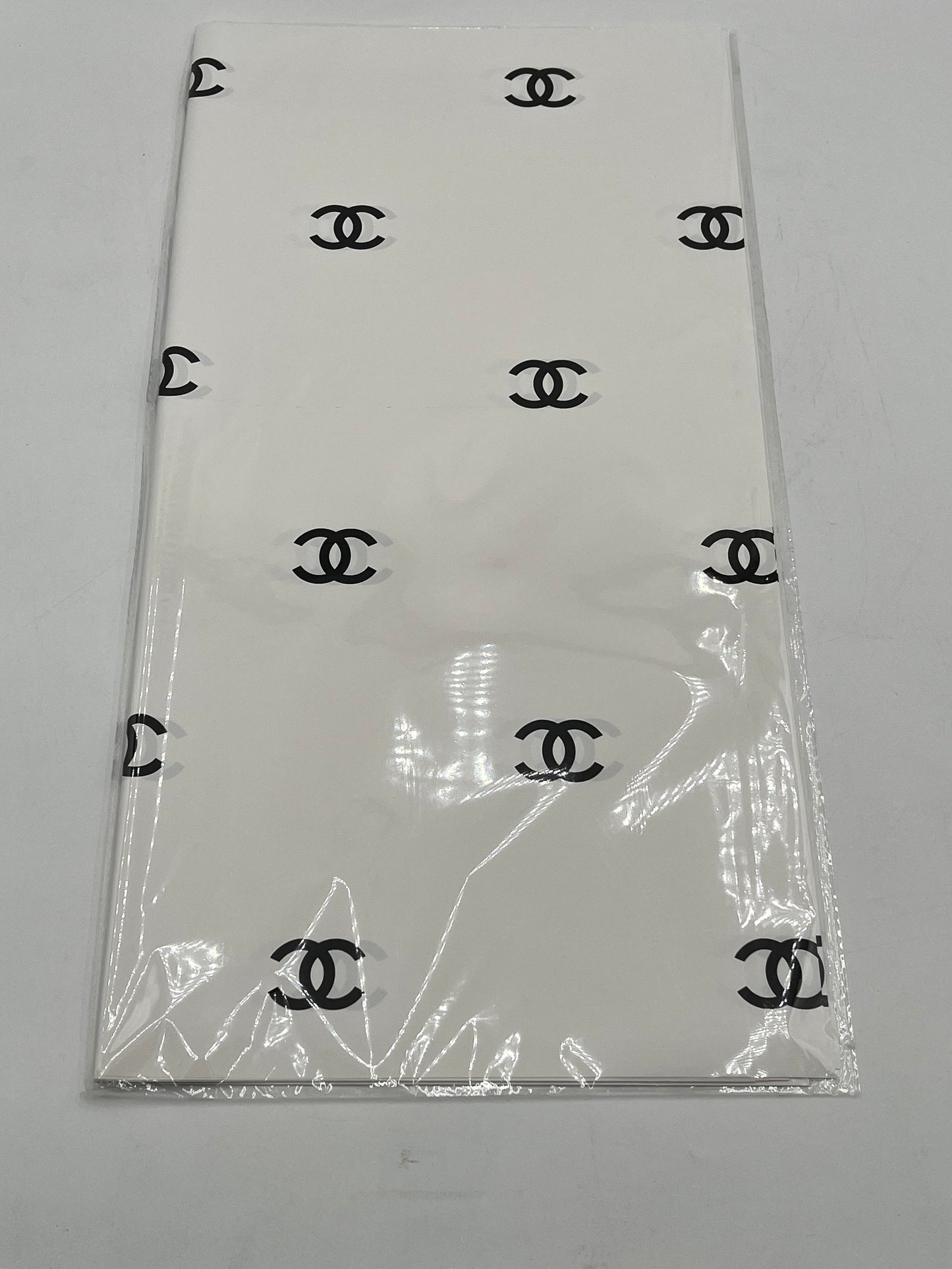 Paris Luxe CC Collection– in white/black, designer-inspired wrapping papers with gold & black logos. 20 sheet pack for $9.99 each by floralsuppliespoint1.com
