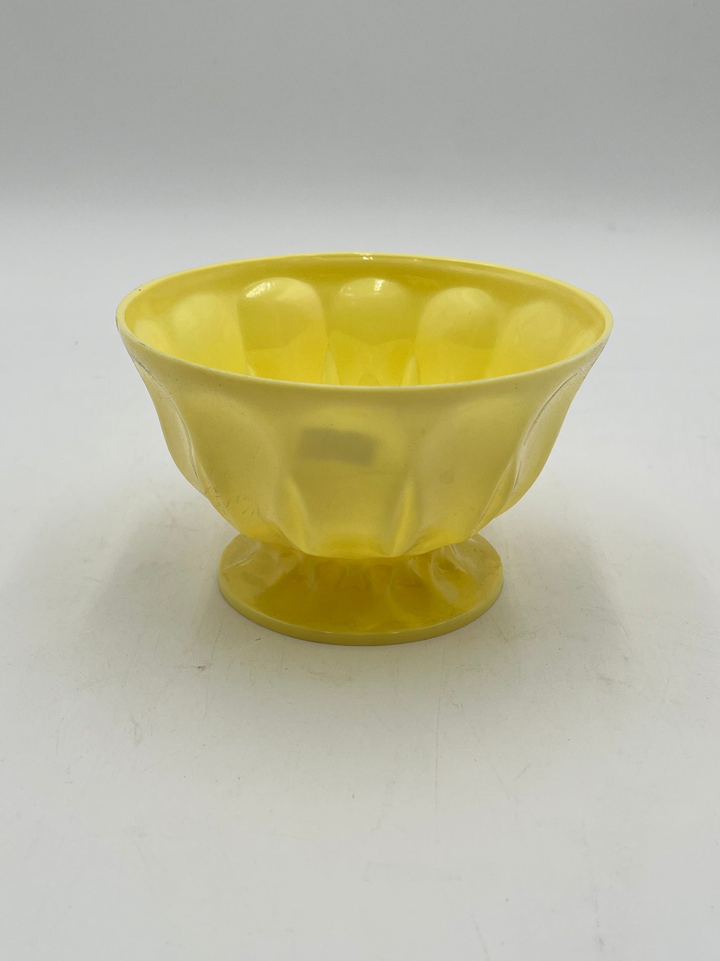 A pastel pedestal bowl in yellow. Perfect 4x6 floral base for décor or sympathy tributes. Available @ floralsuppliespoint1.com for $5.99