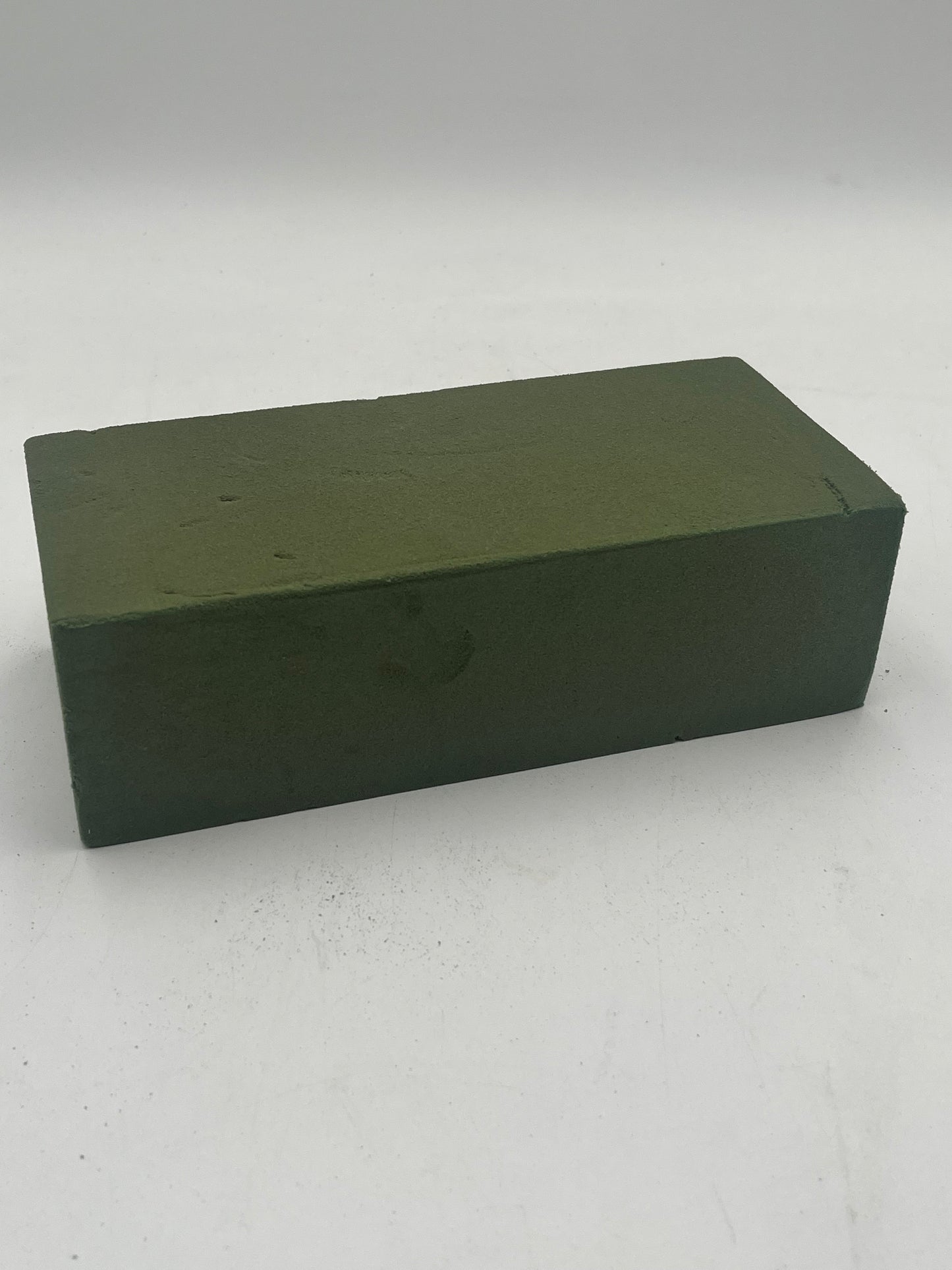Premium floral foam block 3x4x9 inches, sold for $1.99 by floralsuppliespoint1.com. Perfect for fresh flower arrangements & event décor.