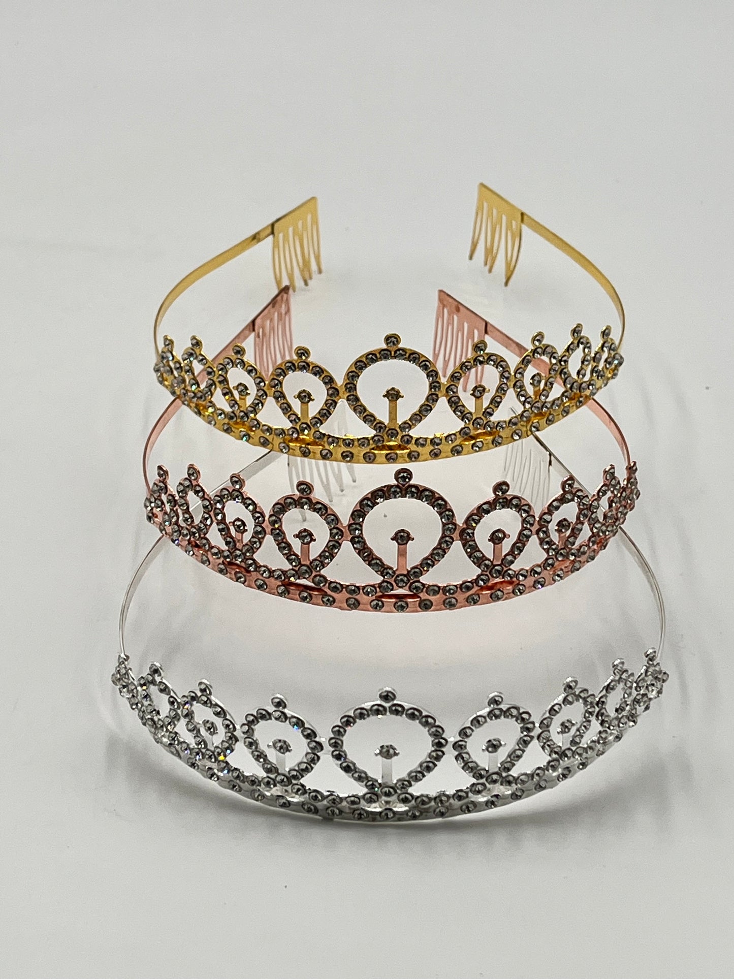 Royal Crystal Tiara Headband in gold, rose gold, and silver, sold retail & wholesale by floralsuppliespoint1.com. Ideal for birthdays & celebrations.