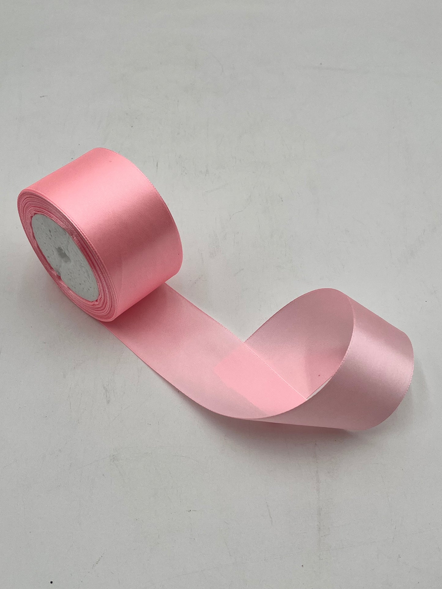 Satin ribbon rolls 1.5" & 2" x 25 yards in Red, Pink, White & Black. Sold individually or in packs by floralsuppliespoint1.com.