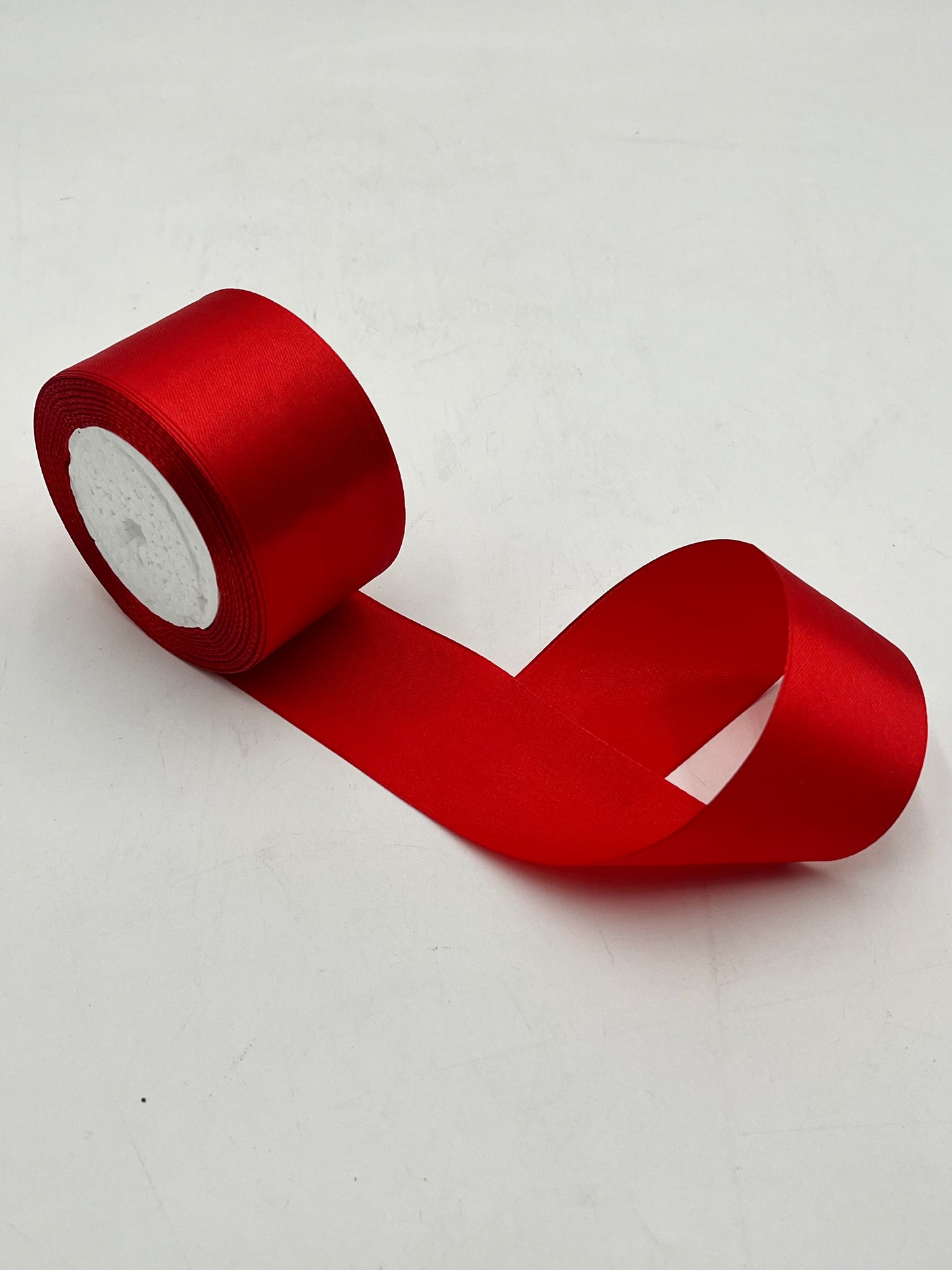 Satin ribbon rolls 1.5" & 2" x 25 yards in Red, Pink, White & Black. Sold individually or in packs by floralsuppliespoint1.com.