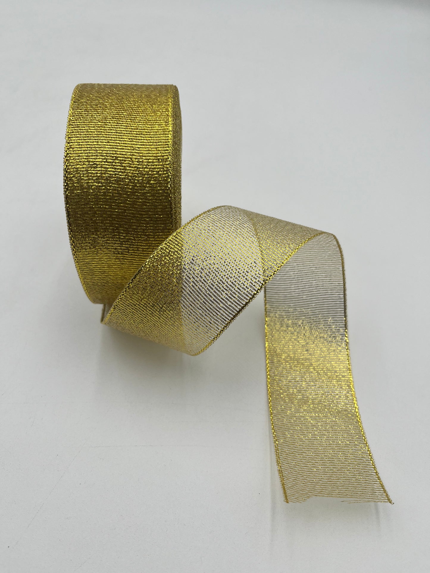 Gold polyester ribbon roll in 2” x 25 yards, ideal for floral design, gifts and crafts. Sold individually by floralsuppliespoint1.com.