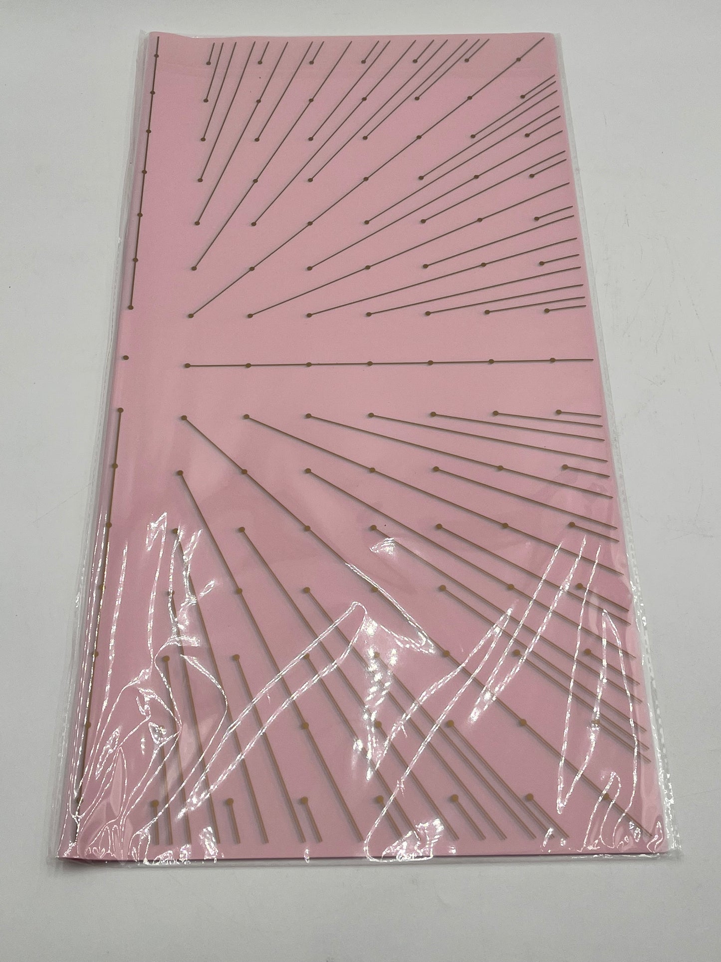 Starlight Burst floral wrapping paper with gold burst accents, available in Pink, 22x22", 20 per pack for $9.99. Available @ floralsuppliespoint1.com