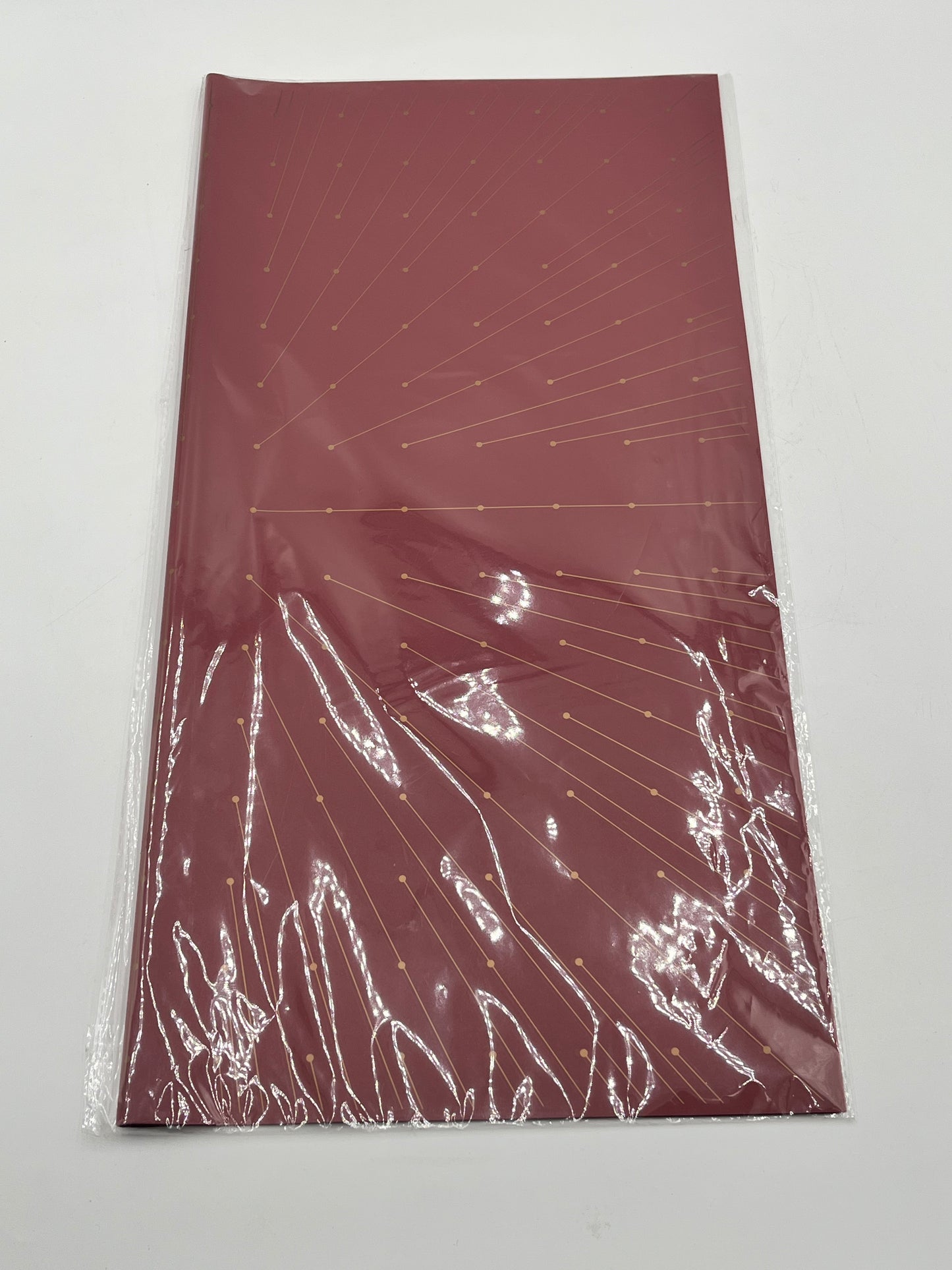 Starlight Burst floral wrapping paper with gold burst accents, available in Wine Red, 22x22", 20 per pack for $9.99. Available @ floralsuppliespoint1.com