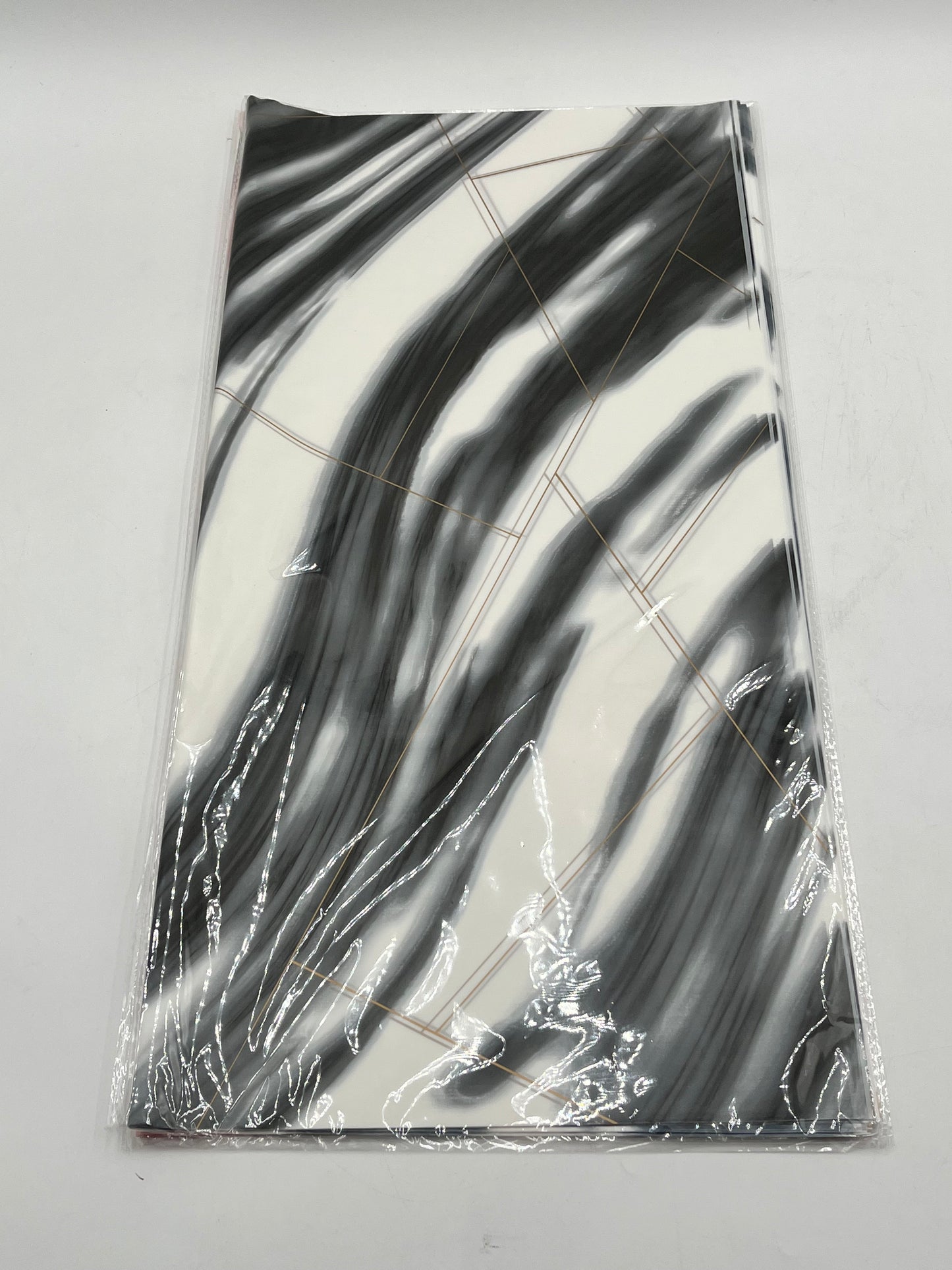 Wrapping sheets in Black marble swirl designs, 22x22 inch (20 sheets). Sold by floralsuppliespoint1.com for $9.99