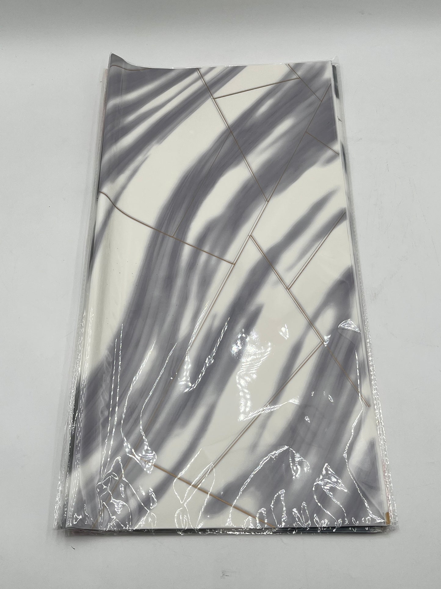 Wrapping sheets in Gray marble swirl designs, 22x22 inch (20 sheets). Sold by floralsuppliespoint1.com for $9.99