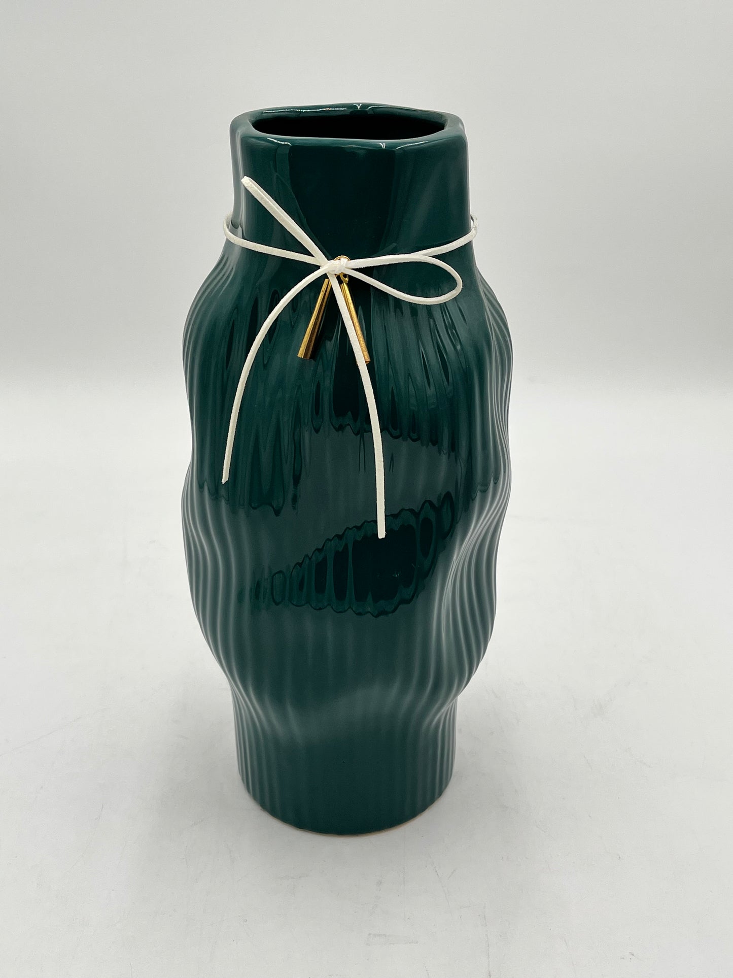 Modern & sophisticated 13"x3" ceramic vases with tassel detail in Green. Sold by floralsuppliespoint1.com for $19.99 each