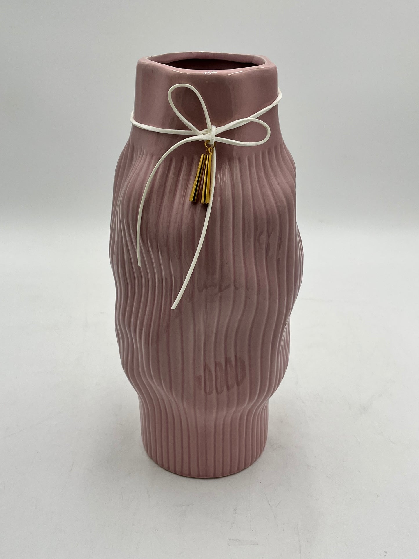 Modern & sophisticated 13"x3" ceramic vases with tassel detail in Dusty Rose. Sold by floralsuppliespoint1.com for $19.99 each