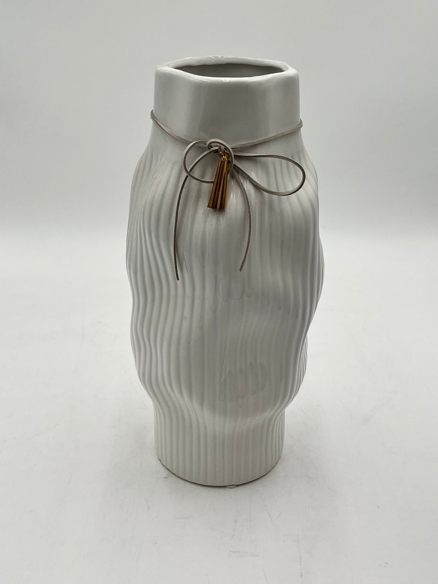 Modern & sophisticated 13"x3" ceramic vases with tassel detail in White. Sold by floralsuppliespoint1.com for $19.99 each