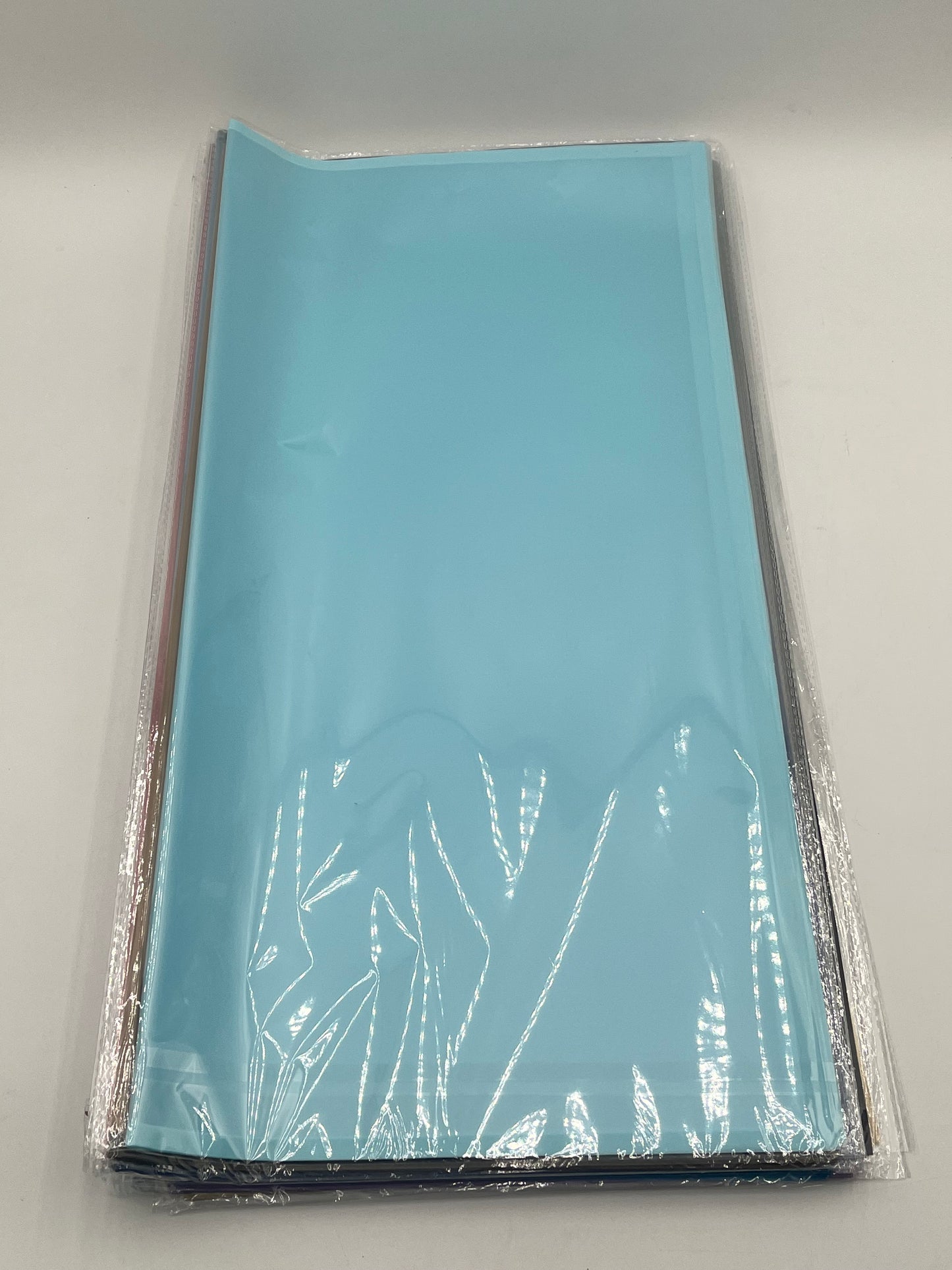 Translucent wrapping papers with 1/4" accent trim in Baby blue color. 20-pack sheets elevate bouquets, gifts & baskets. Sold by floralsuppliespoint1.com for $9.99