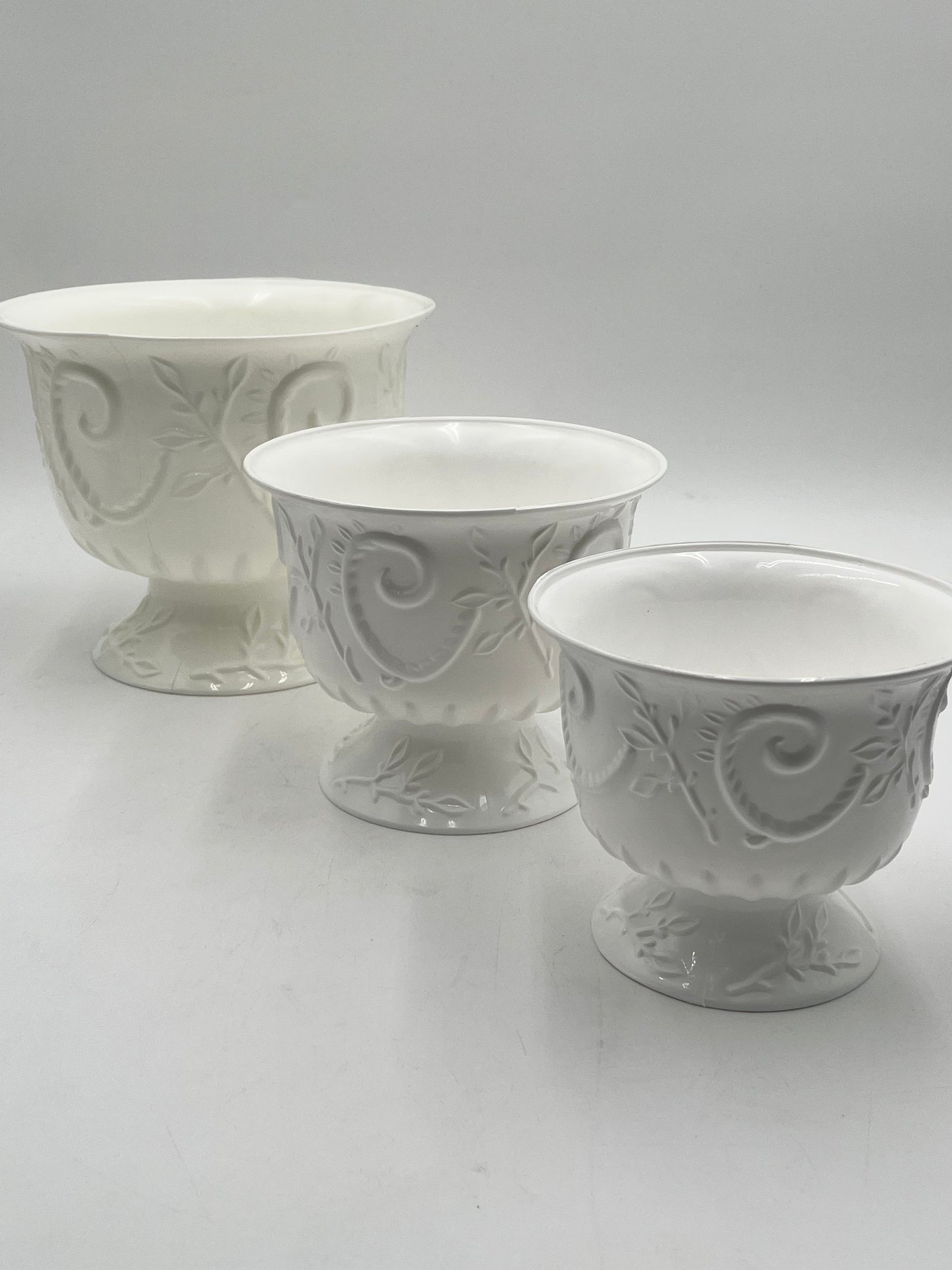 White Empress Urn Collection in 3 sizes. Elegant scrollwork pedestal urns for floral designs, décor, centerpieces or events- sold by floralsuppliespoint1.com