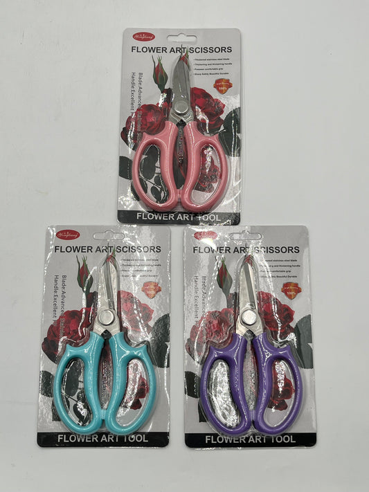6.5" flower art scissors with stainless steel blades, ergonomic handle, and 3 color options: pink, teal & purple. Sold for $7.99 retail by floralsuppliespoint1.com.