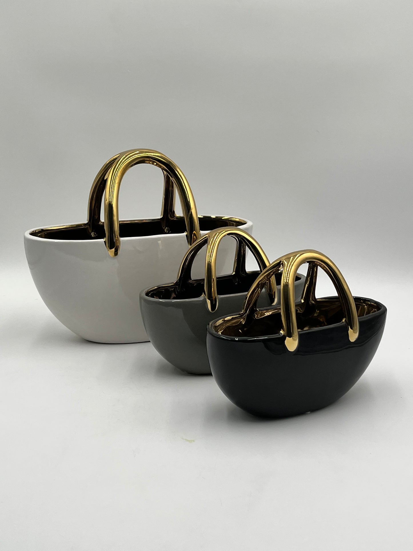 The Arcora series of vases are sculptural ceramic objects that transcends traditional form sold by floralsuppliespoint1.com