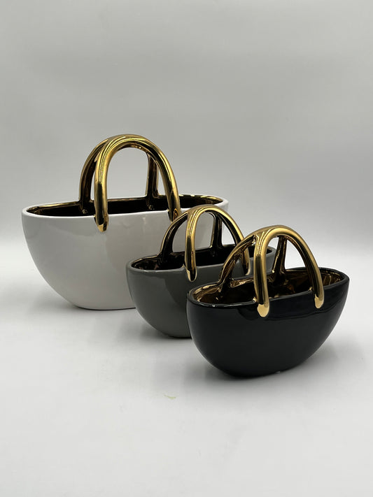 The Arcora series of vases are sculptural ceramic objects that transcends traditional form sold by floralsuppliespoint1.com