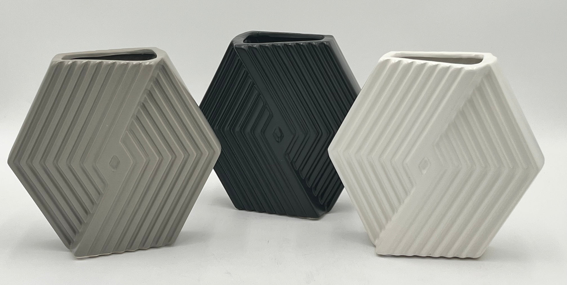 Chevron Crest Mini ceramic vases in matte black, grey, and white with geometric texture, sold by floralsuppliespoint1.com for modern floral arrangements or decor.