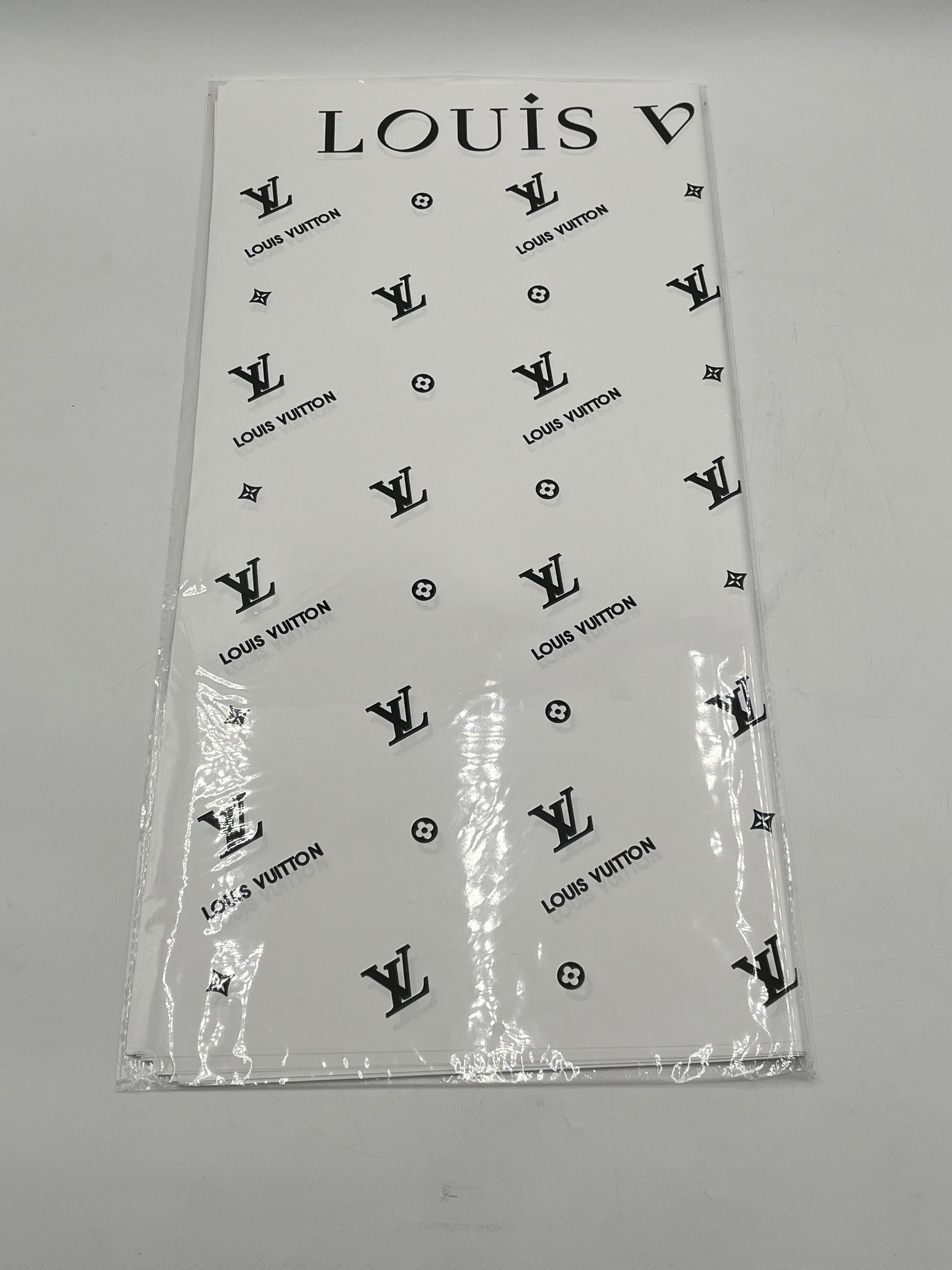 Enhance gifting with the Couture LV Collection. 20 luxury wrapping sheets (22x22) in white. $9.99 per pack, Sold by floralsuppliespoint1.com
