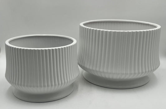 Cove Ridge Set ceramic vases in white with ribbed design and pedestal base, sizes 8"x10.5 Op and 6.5"x8 Op, total weight 11.50 lbs, available at floralsuppliespoint1.com.