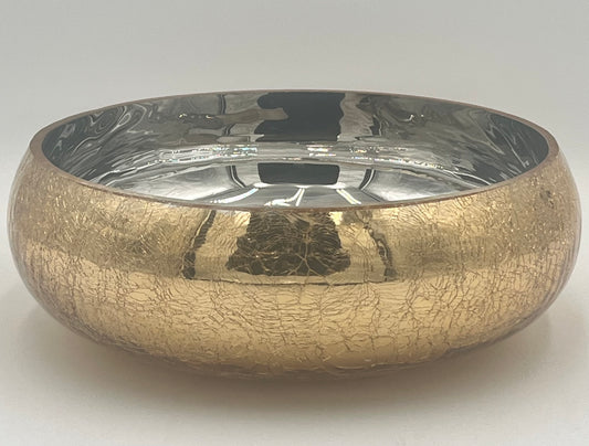 The Crackle Halo 4x9.5 Op by Floral Supplies Point is a round bowl featuring a gold crackled glass finish and a reflective silver interior, ideal for displaying floral arrangements against a simple light background.